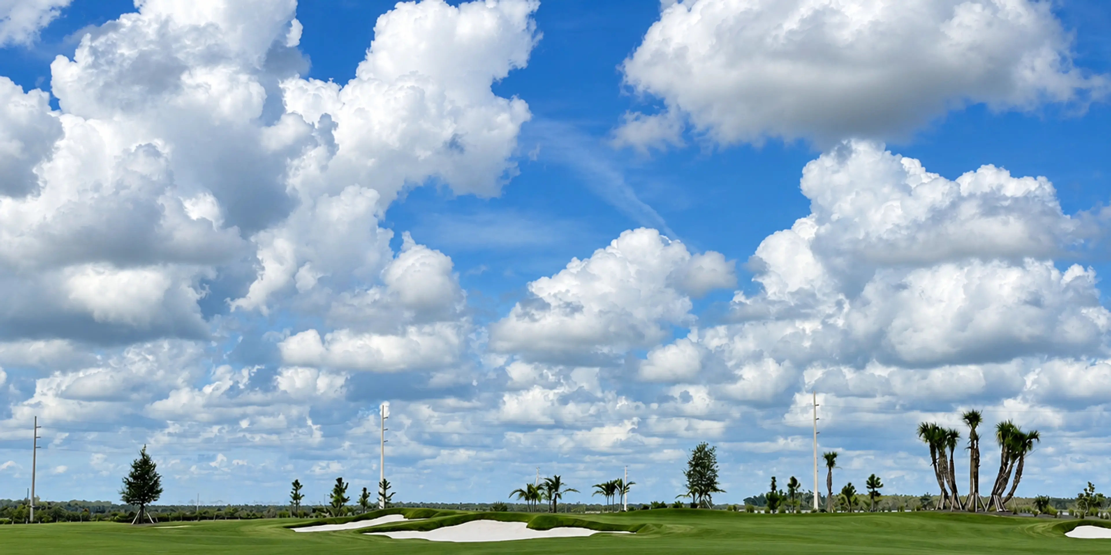 Landscape putting greens and fairway photo of the Esplanade at Rivergrass golf course