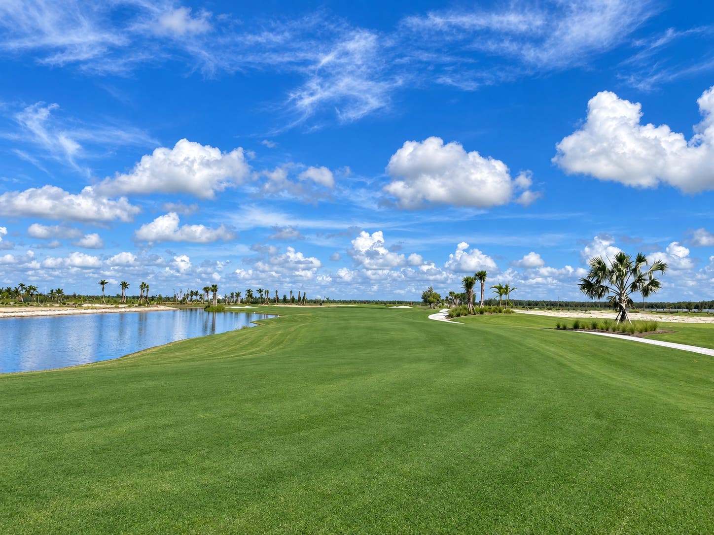 Landscape putting greens and fairway photo of the Esplanade at Rivergrass golf course