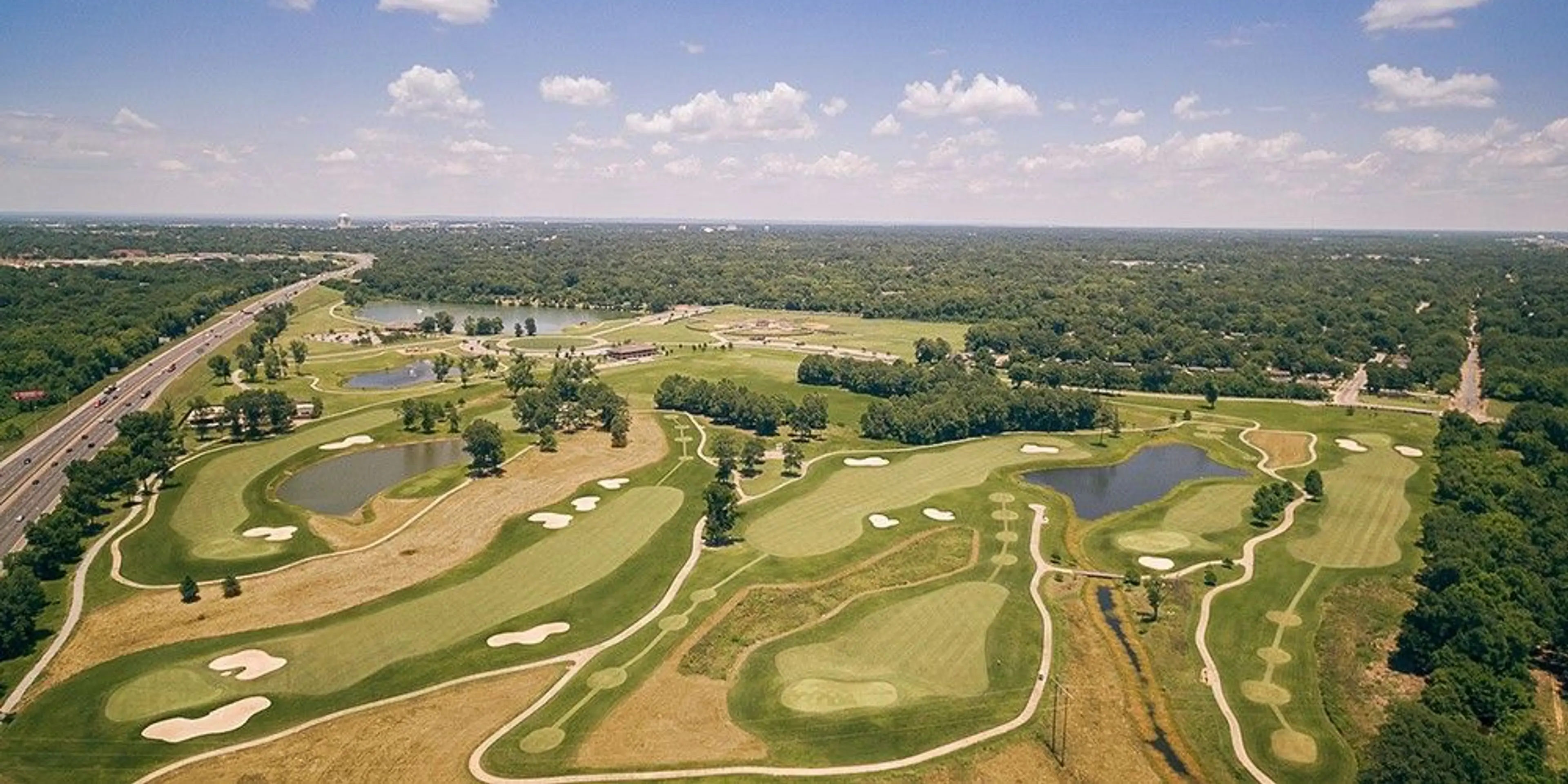 Landscape putting greens and fairway photo of the Gateway Park Golf Course golf course
