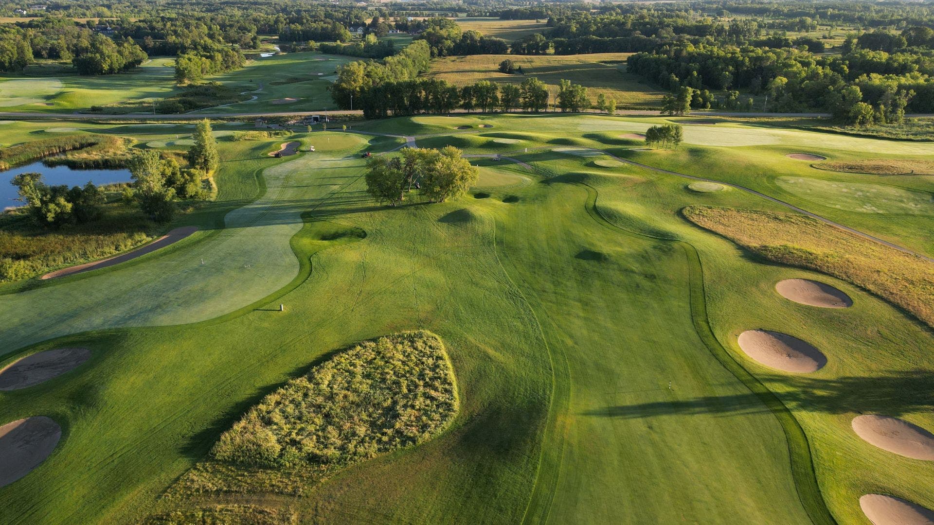 Landscape putting greens and fairway photo of the Geneva Golf Club golf course