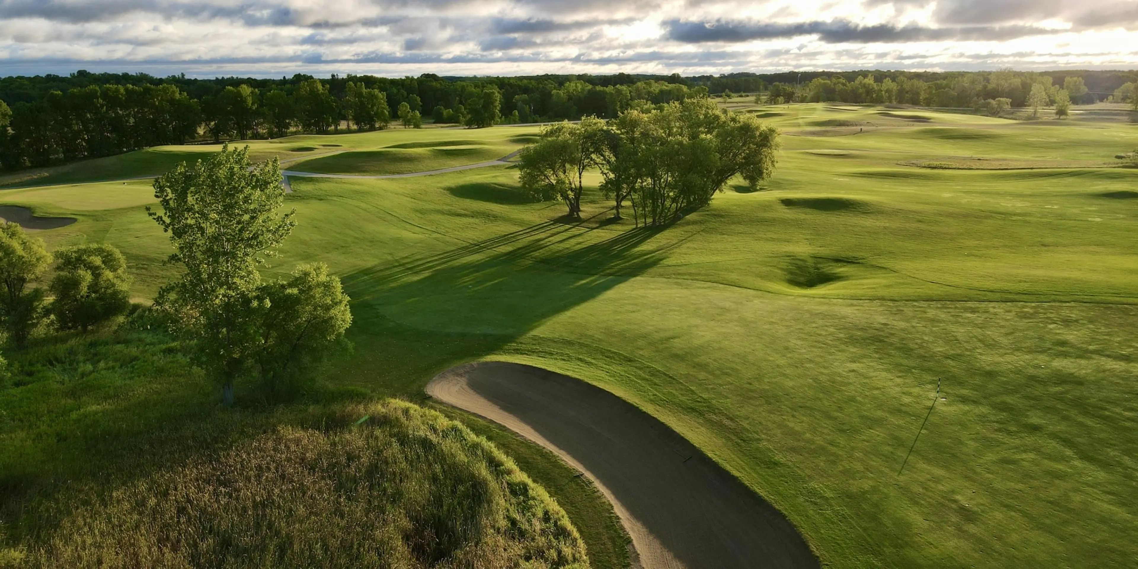 Landscape putting greens and fairway photo of the Geneva Golf Club golf course