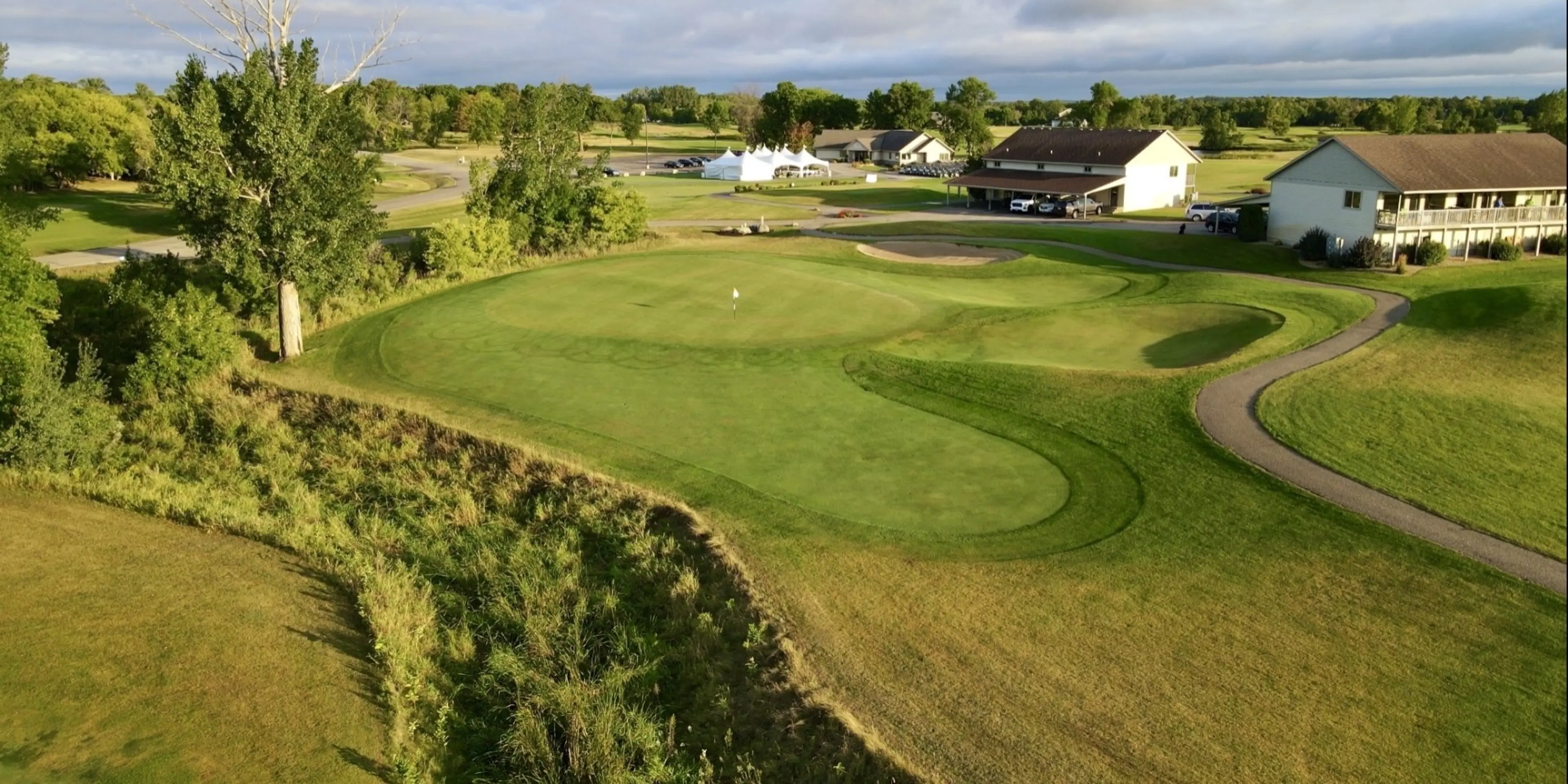 Landscape putting greens and fairway photo of the Geneva Golf Club golf course