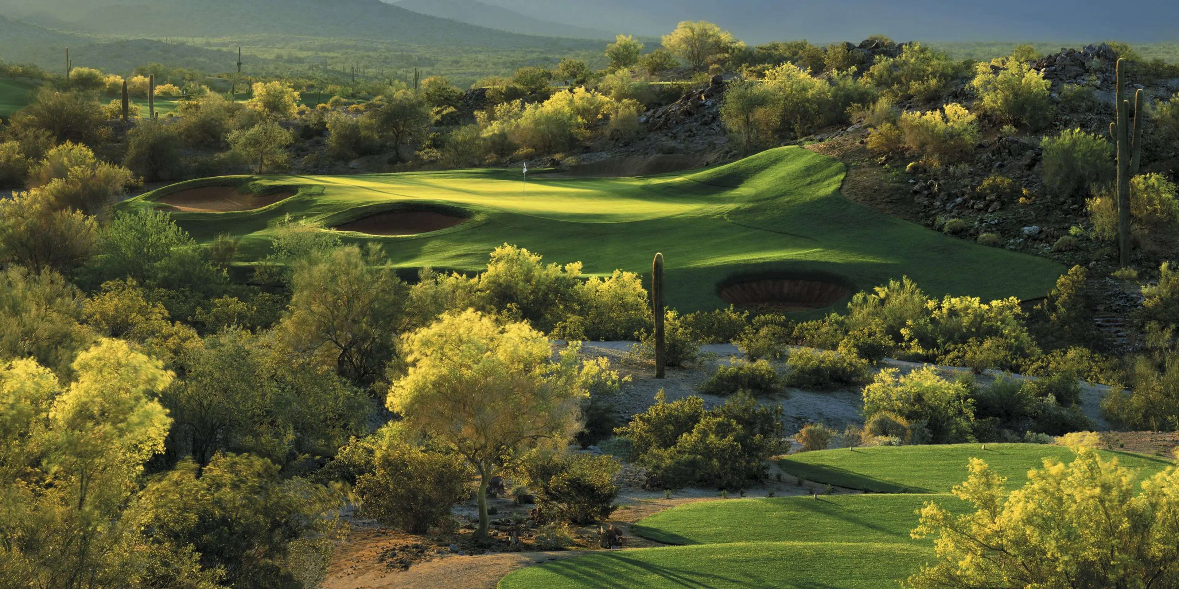 Landscape putting greens and fairway photo of the Golf Club of Estrella golf course
