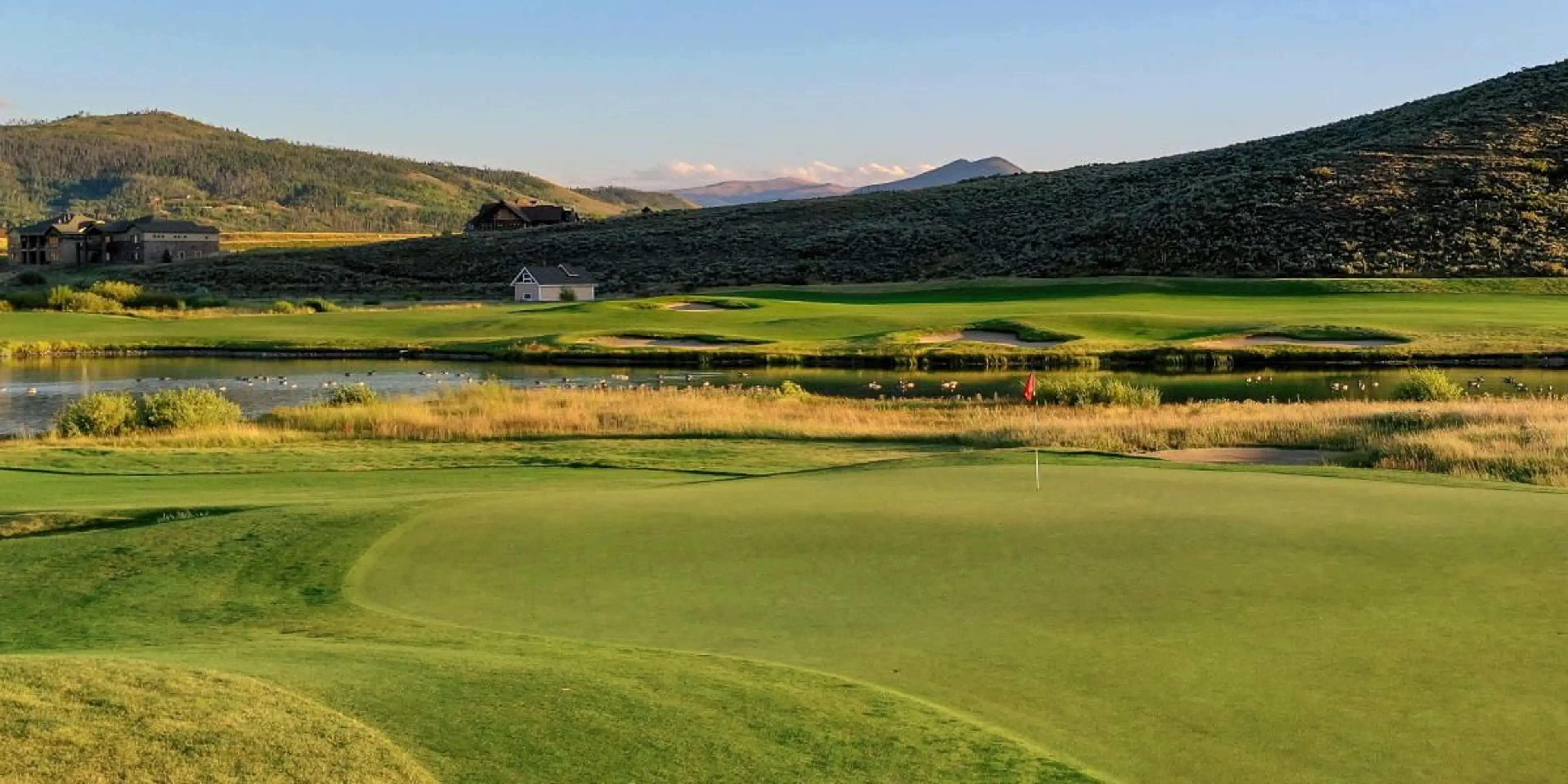 Landscape putting greens and fairway photo of the Grand Elk Golf Club golf course