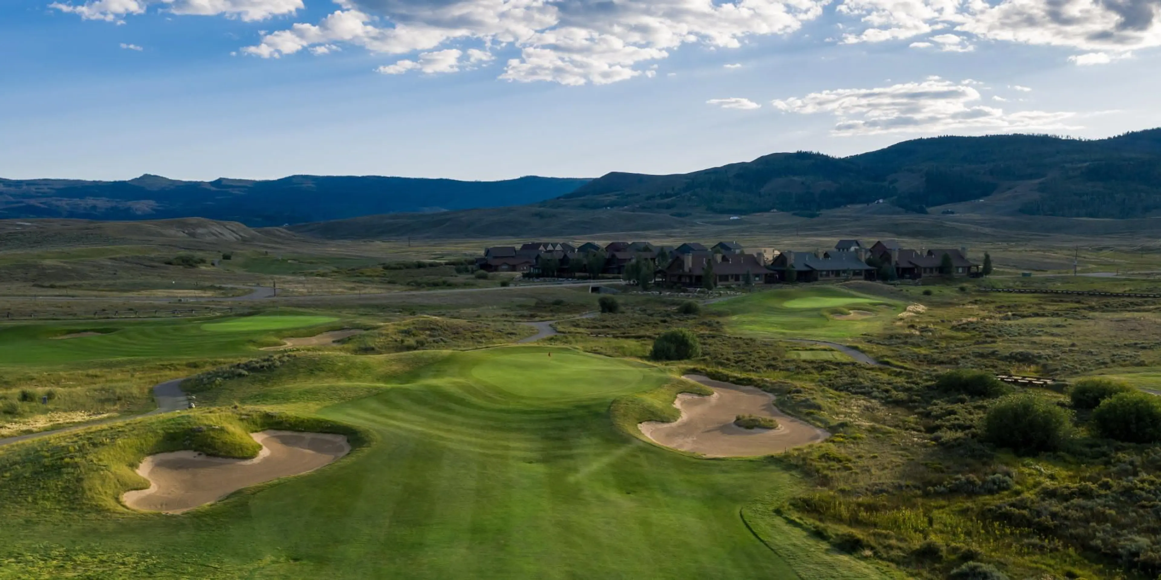 Landscape putting greens and fairway photo of the Grand Elk Golf Club golf course