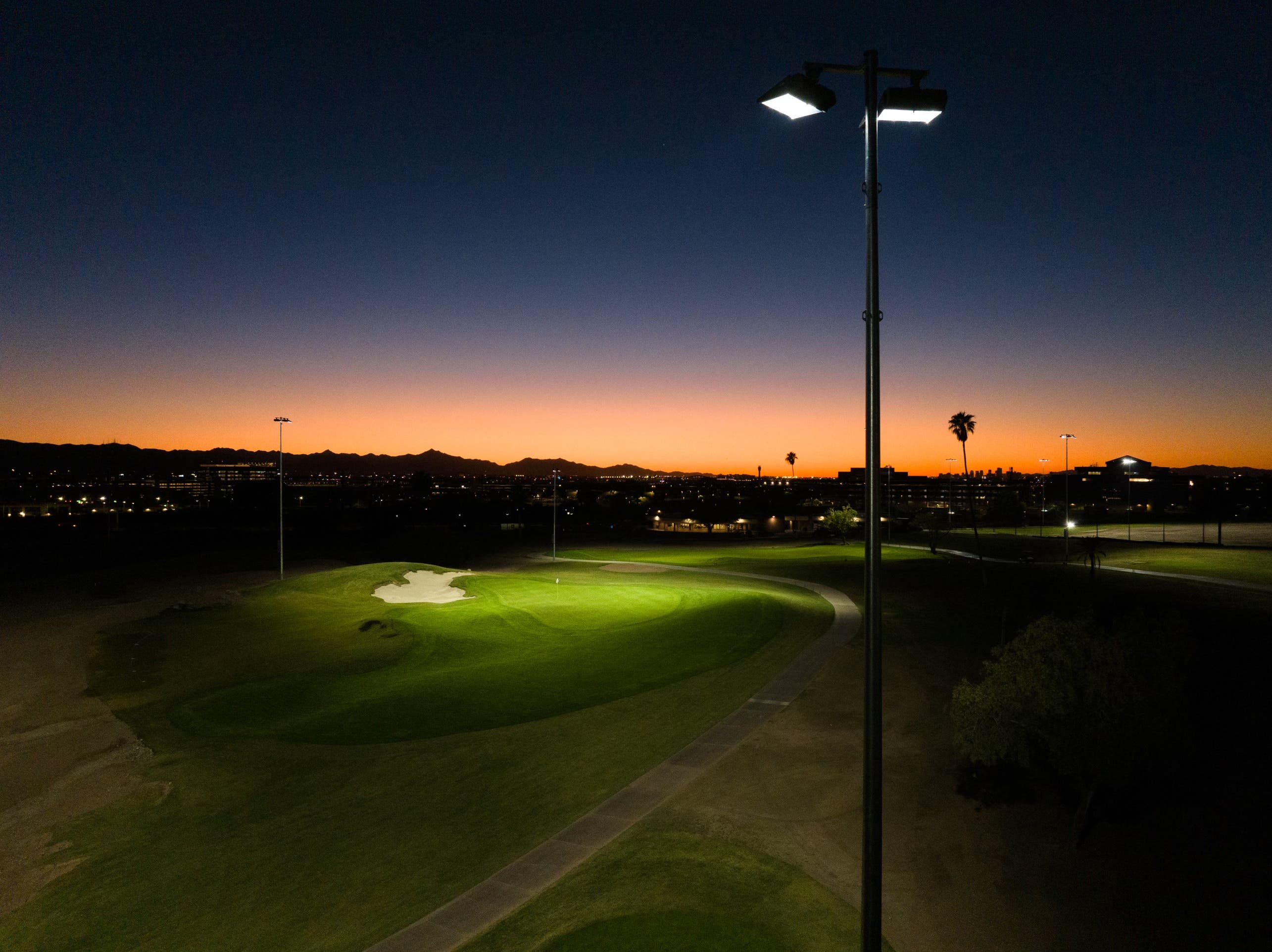 Landscape putting greens and fairway photo of the Grass Clippings Rolling Hills golf course