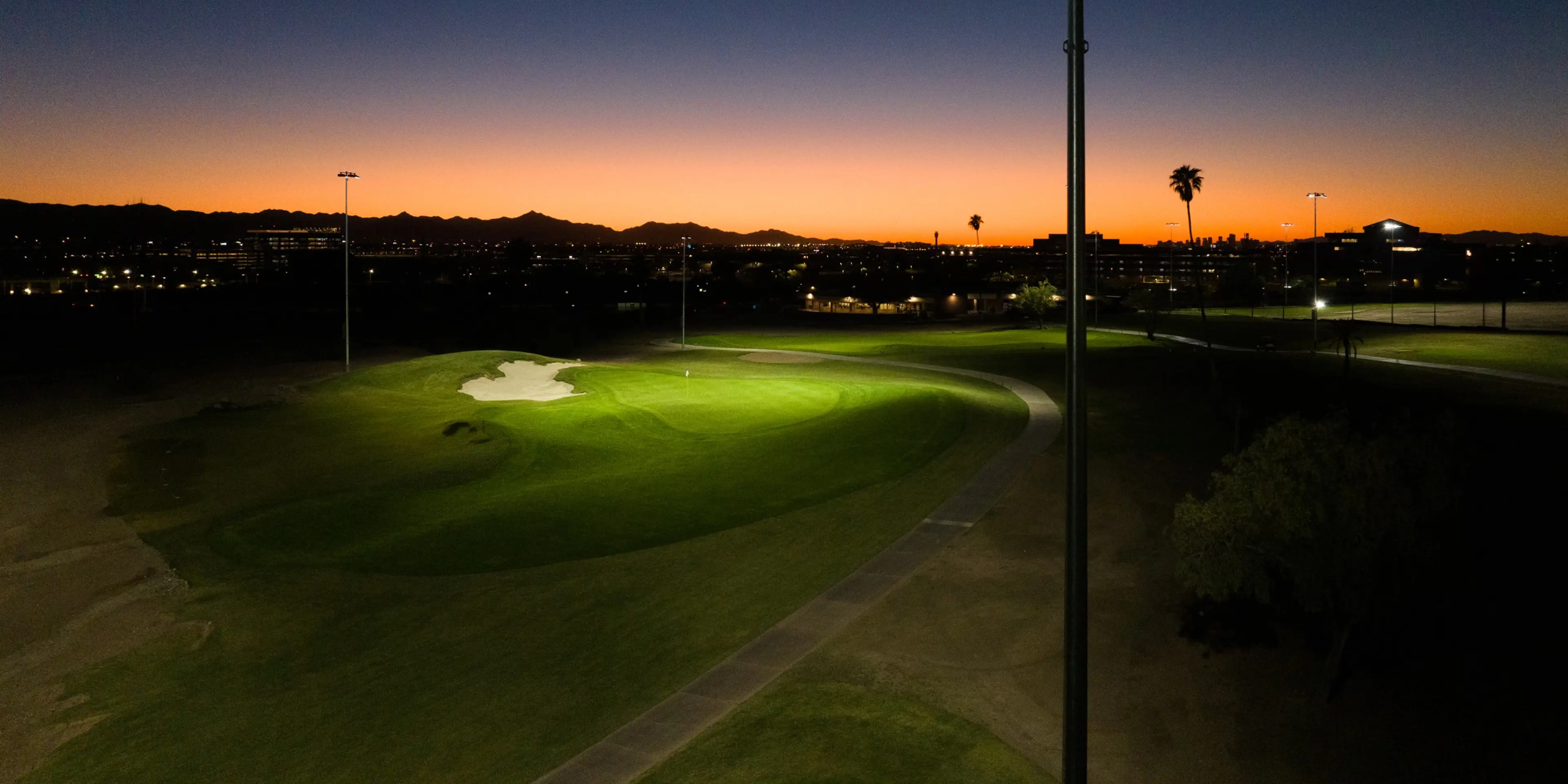 Landscape putting greens and fairway photo of the Grass Clippings Rolling Hills golf course