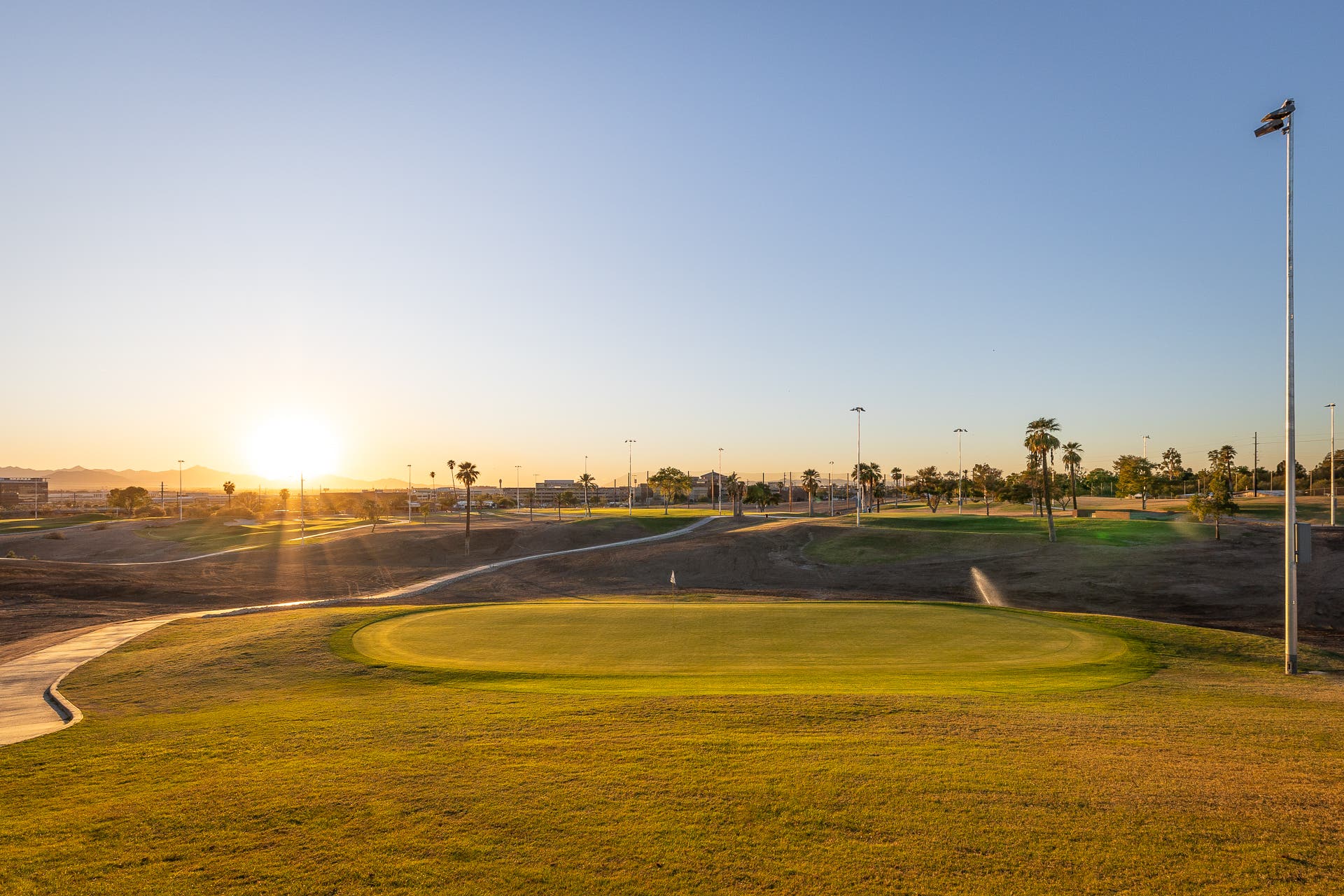 Landscape putting greens and fairway photo of the Grass Clippings Rolling Hills golf course