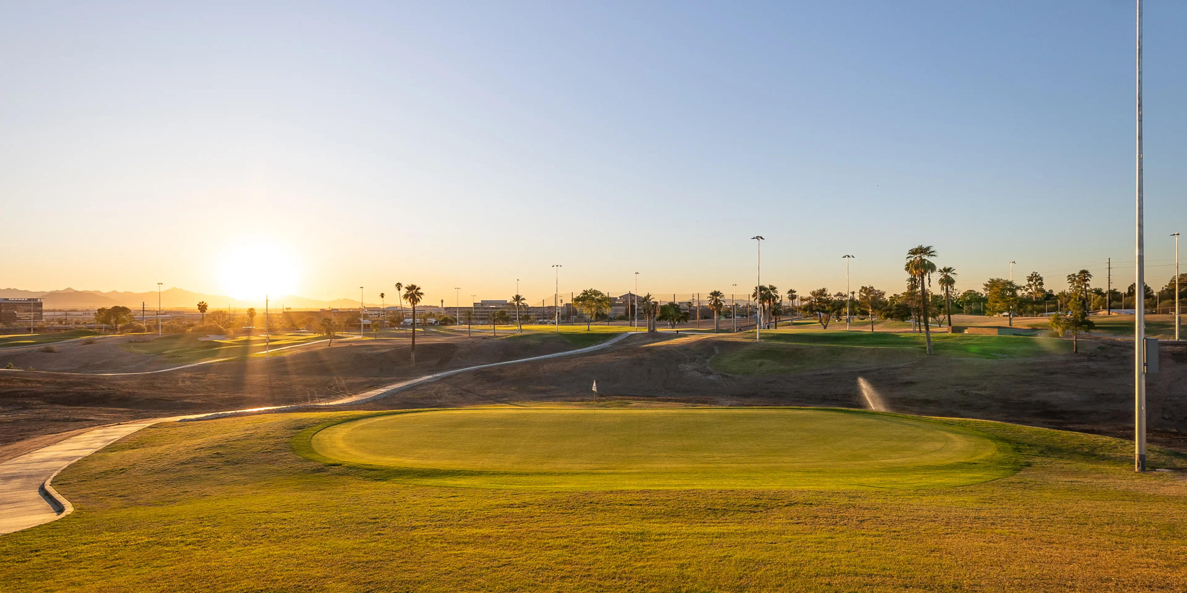 Landscape putting greens and fairway photo of the Grass Clippings Rolling Hills golf course