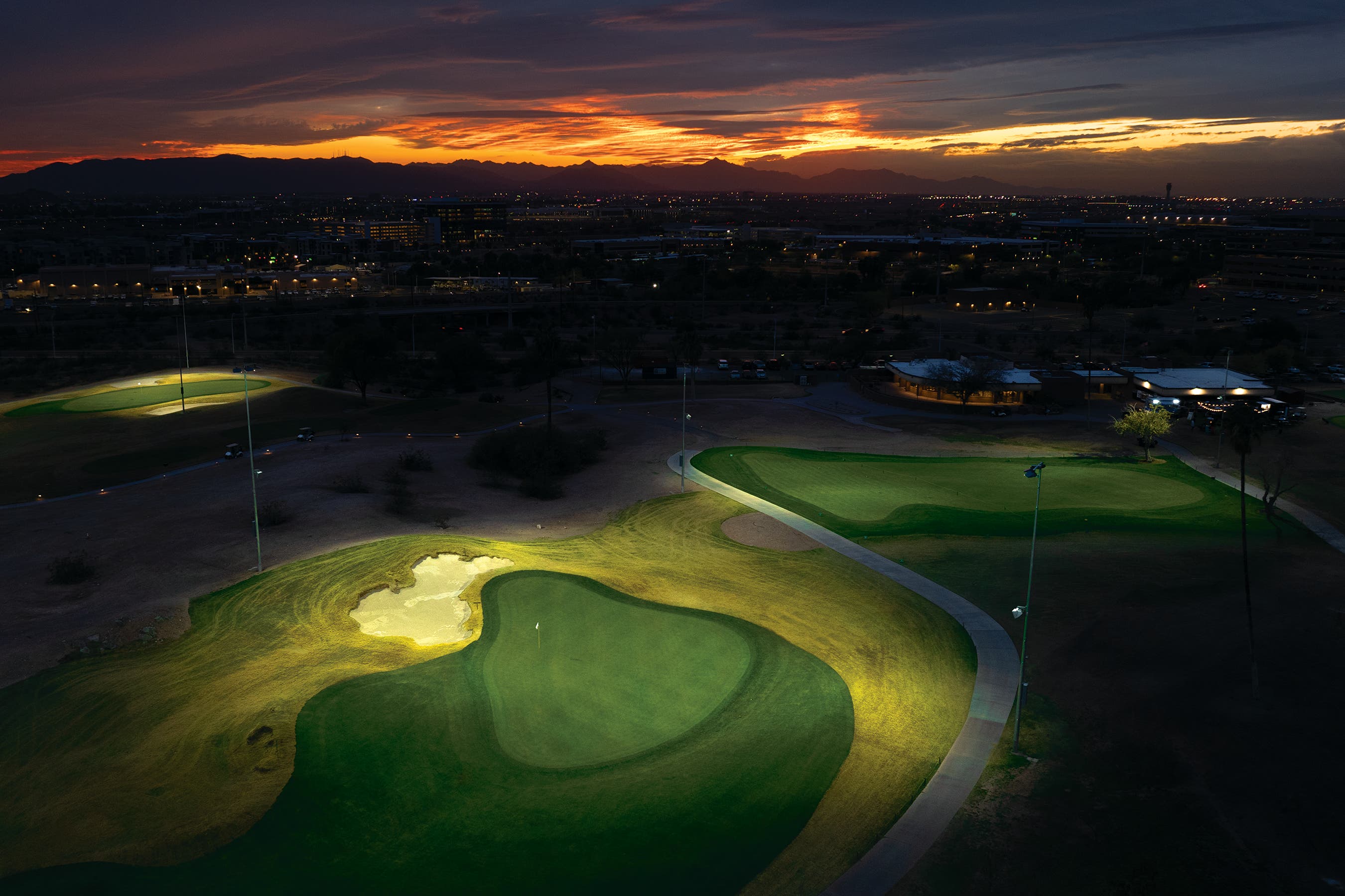 Landscape putting greens and fairway photo of the Grass Clippings Rolling Hills golf course