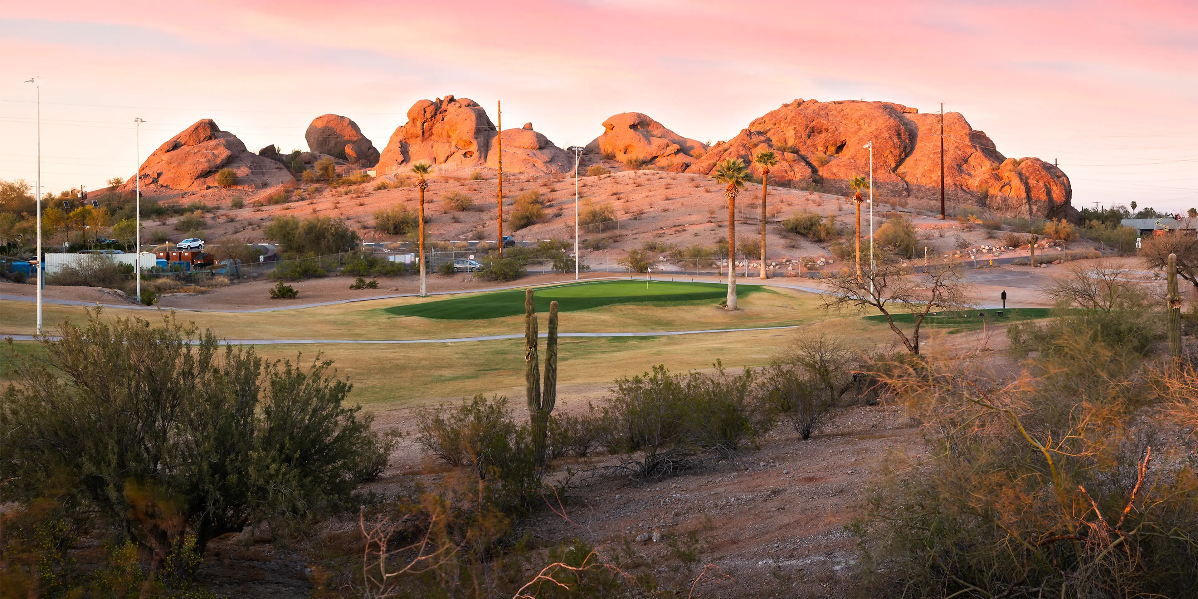 Landscape putting greens and fairway photo of the Grass Clippings Rolling Hills golf course