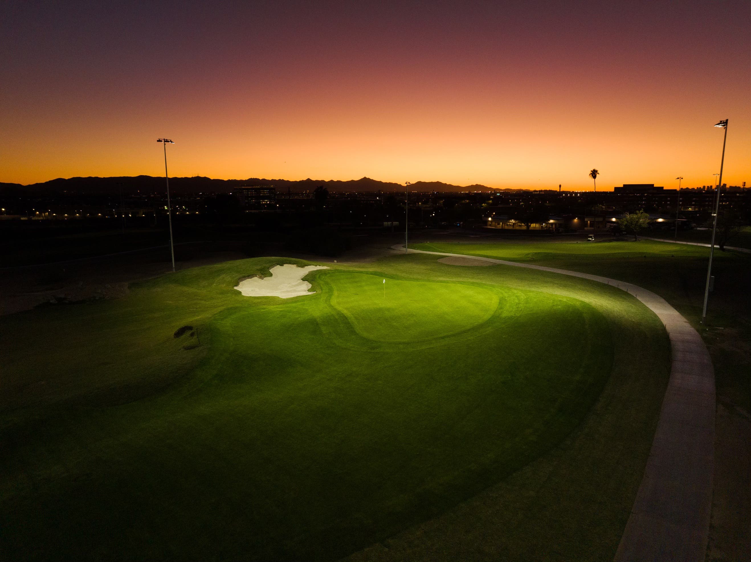 Landscape putting greens and fairway photo of the Grass Clippings Rolling Hills golf course