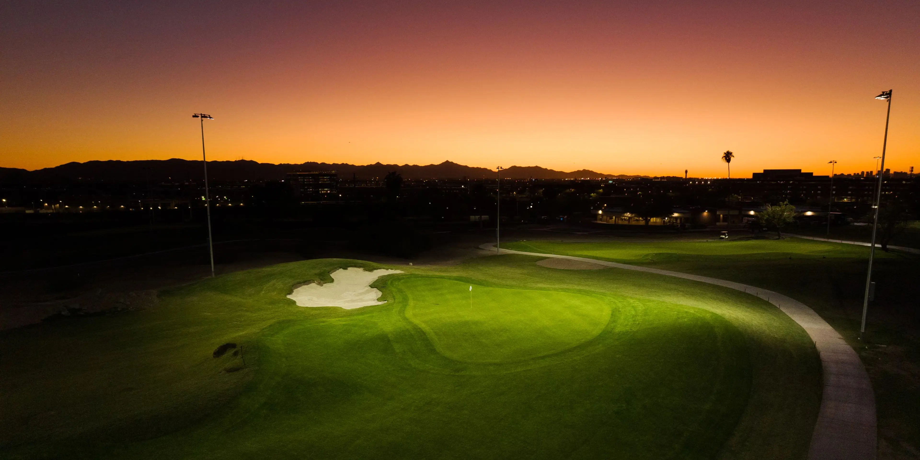 Landscape putting greens and fairway photo of the Grass Clippings Rolling Hills golf course
