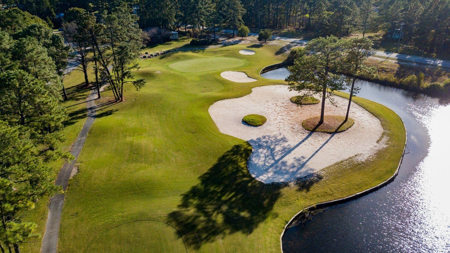 Landscape putting greens and fairway photo of the Harbour Pointe Golf Club golf course