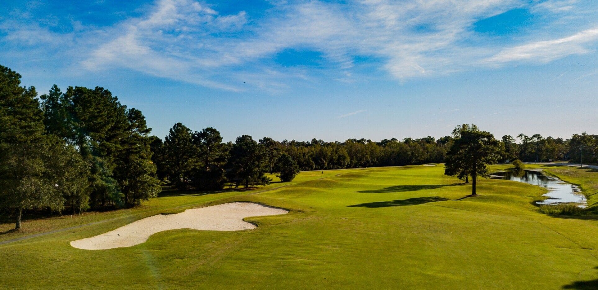 Landscape putting greens and fairway photo of the Harbour Pointe Golf Club golf course