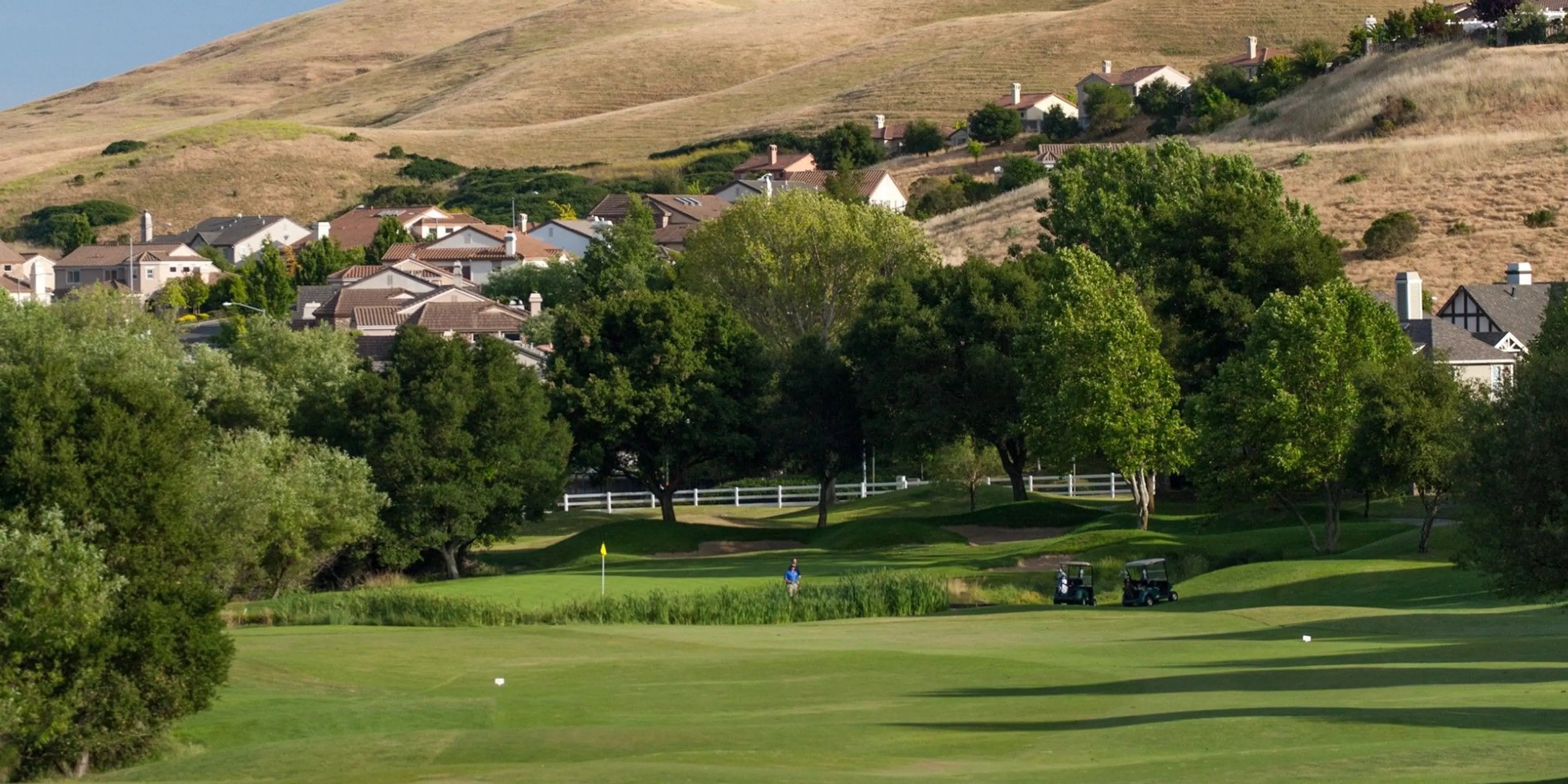 Landscape putting greens and fairway photo of the Hiddenbrooke Golf Club golf course