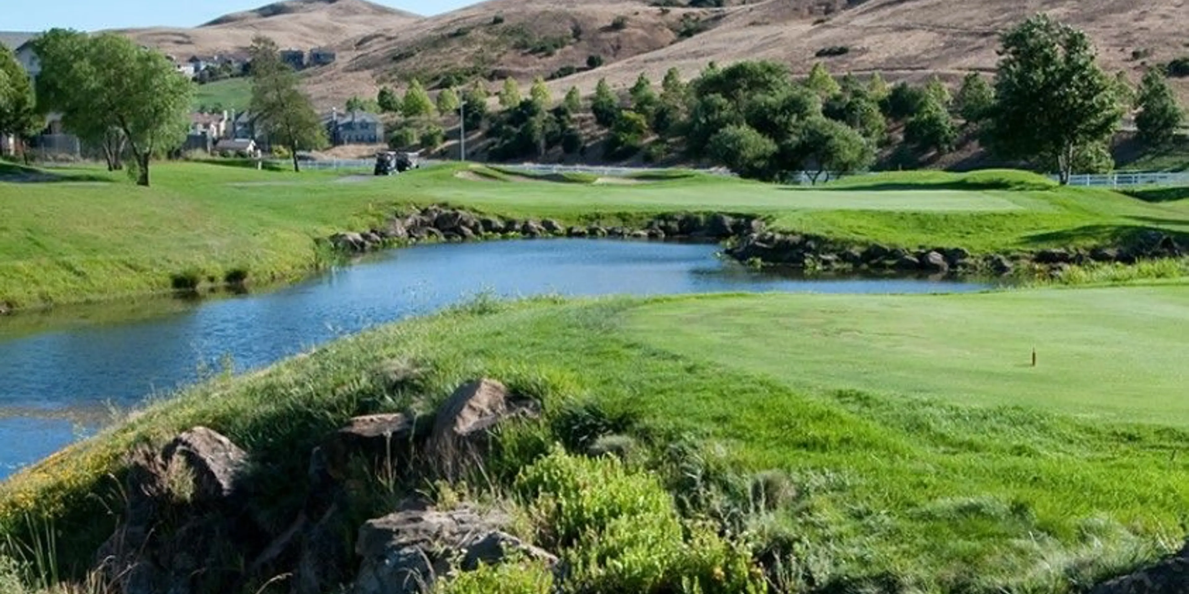 Landscape putting greens and fairway photo of the Hiddenbrooke Golf Club golf course