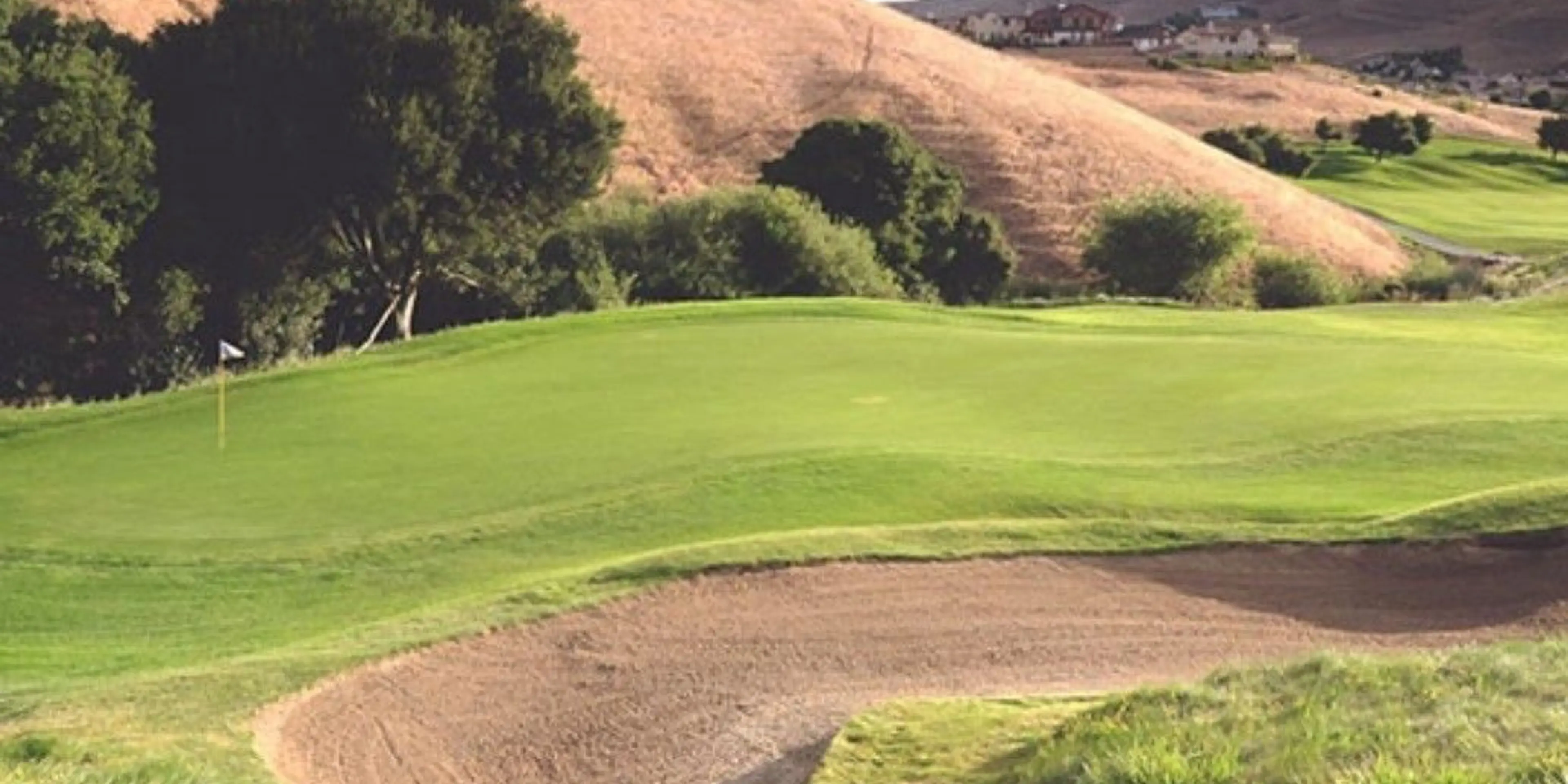 Landscape putting greens and fairway photo of the Hiddenbrooke Golf Club golf course