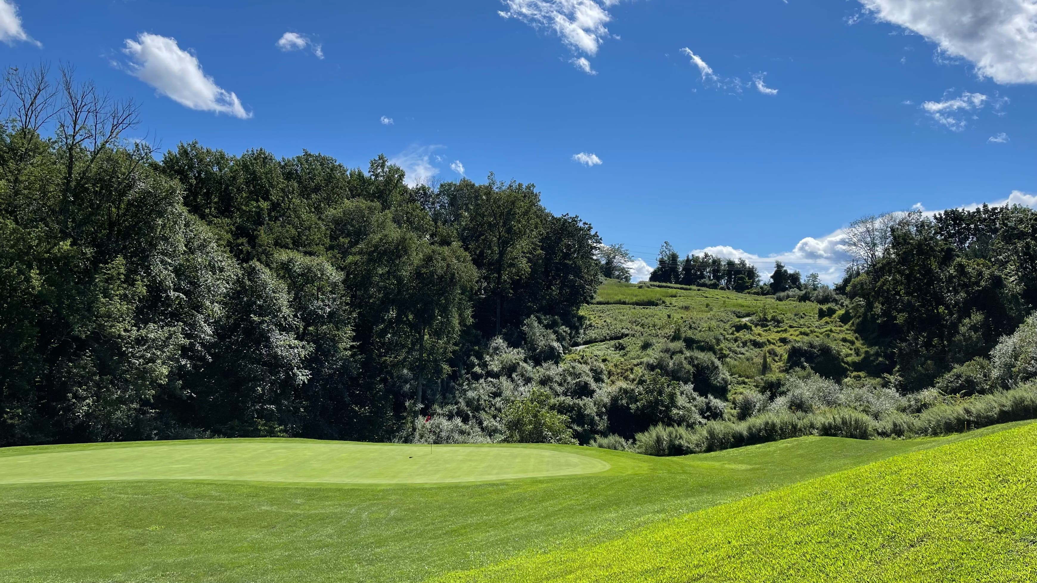 Landscape putting greens and fairway photo of the High Bridge Hills Golf Club golf course