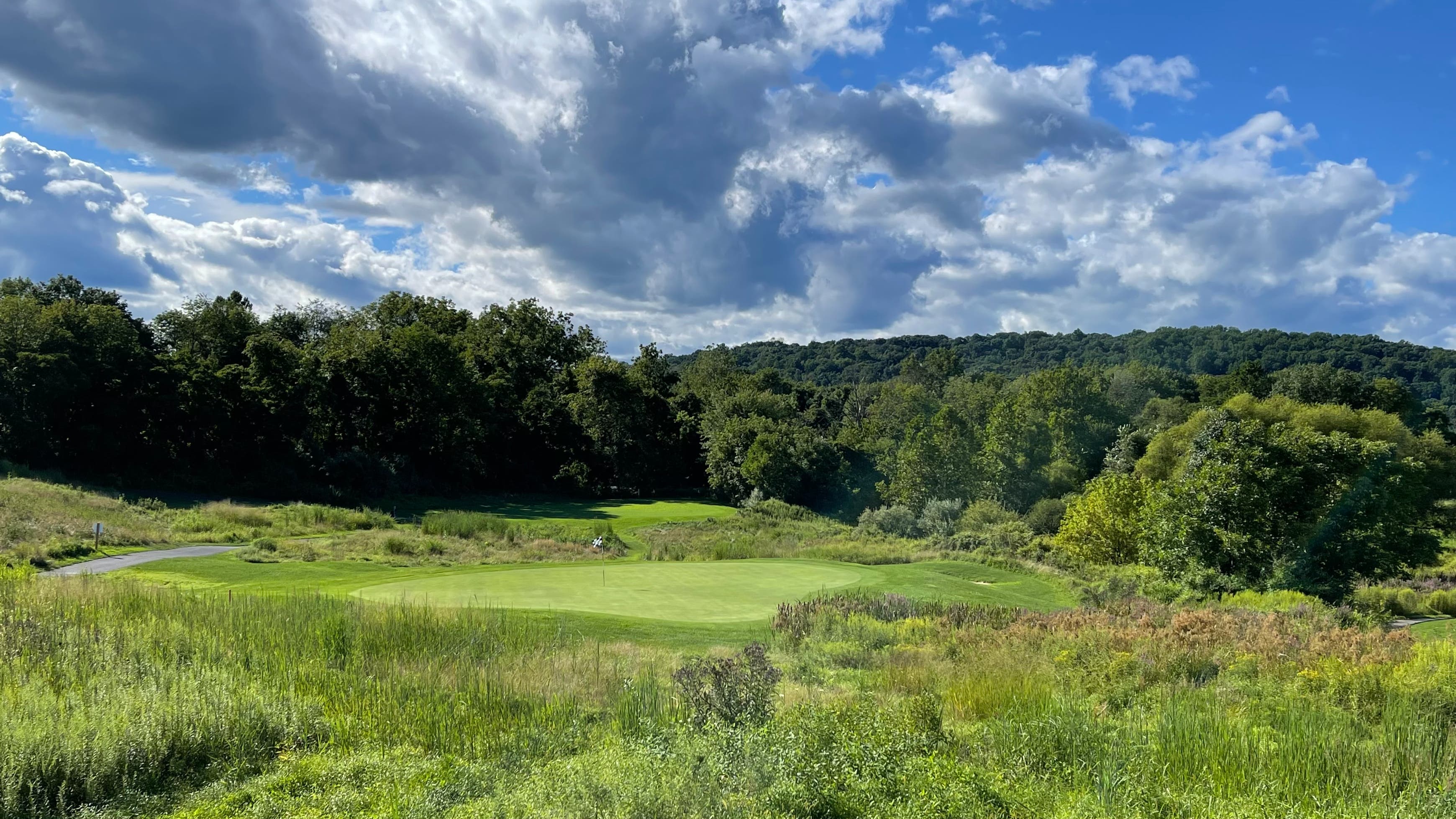 Landscape putting greens and fairway photo of the High Bridge Hills Golf Club golf course