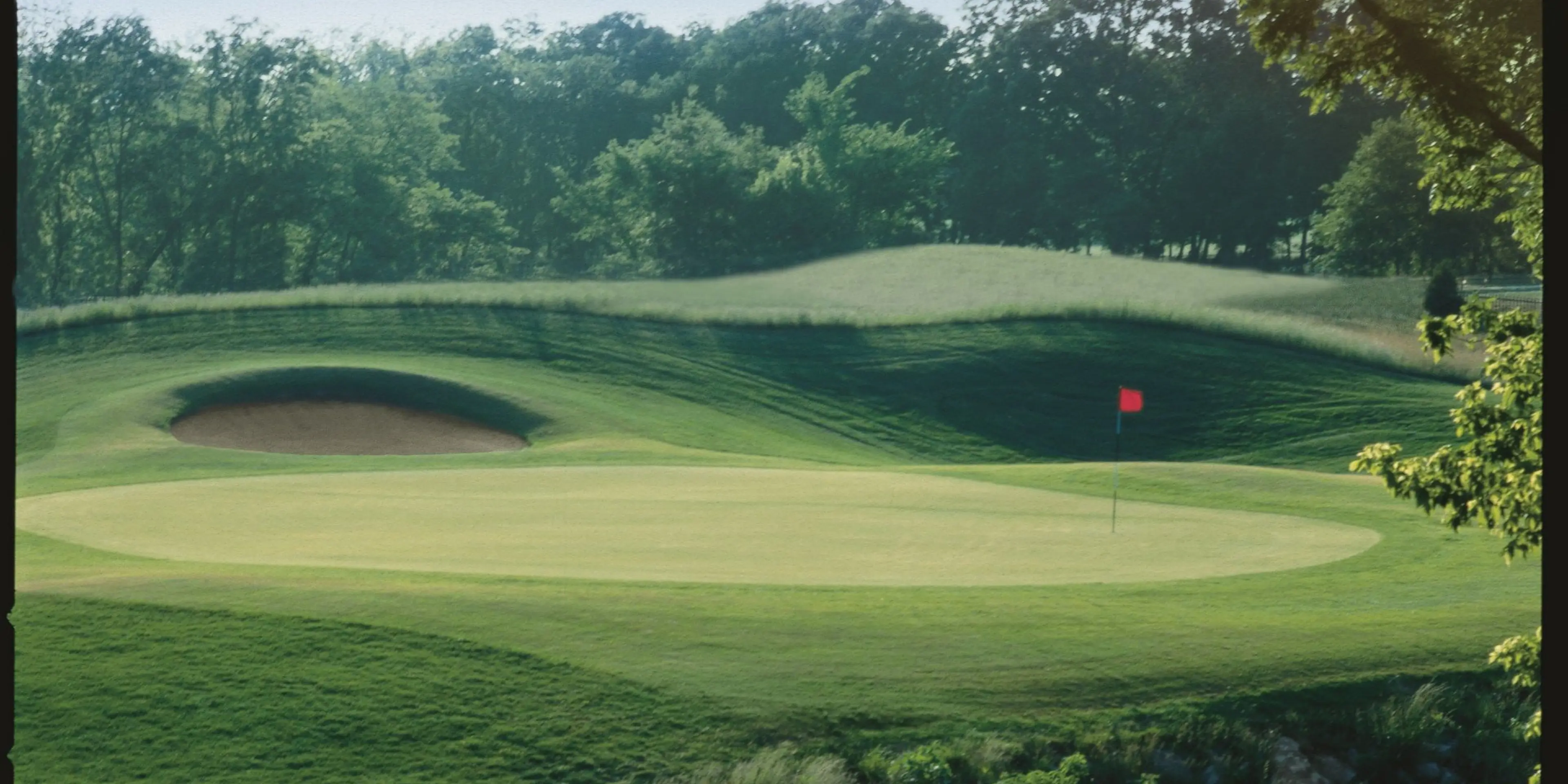Landscape putting greens and fairway photo of the Ironhorse Golf Club golf course