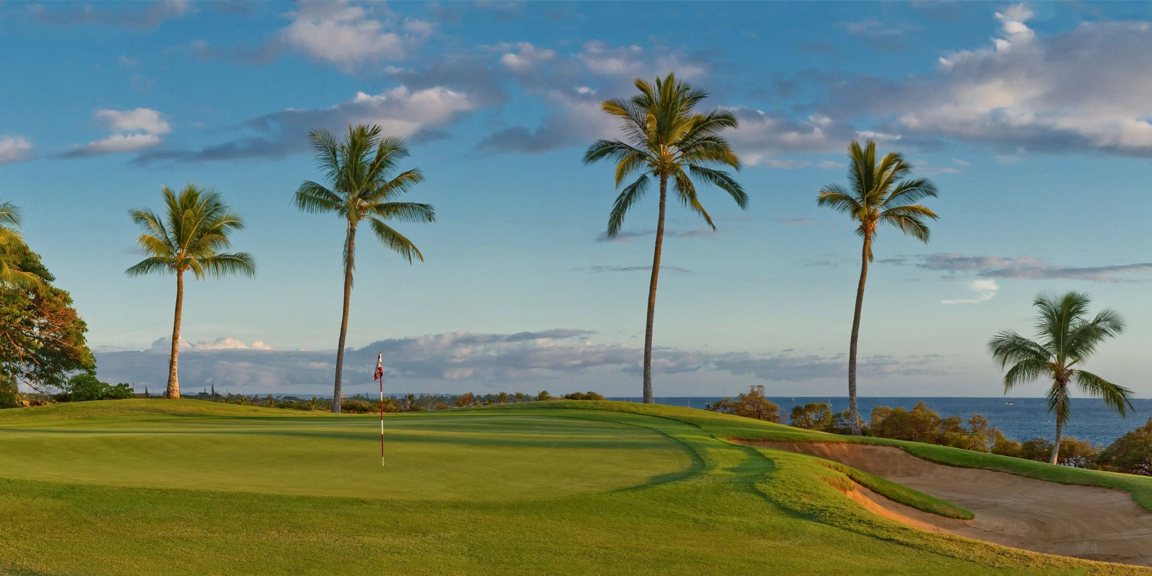 Landscape putting greens and fairway photo of the Ka'anapali Golf Courses golf course