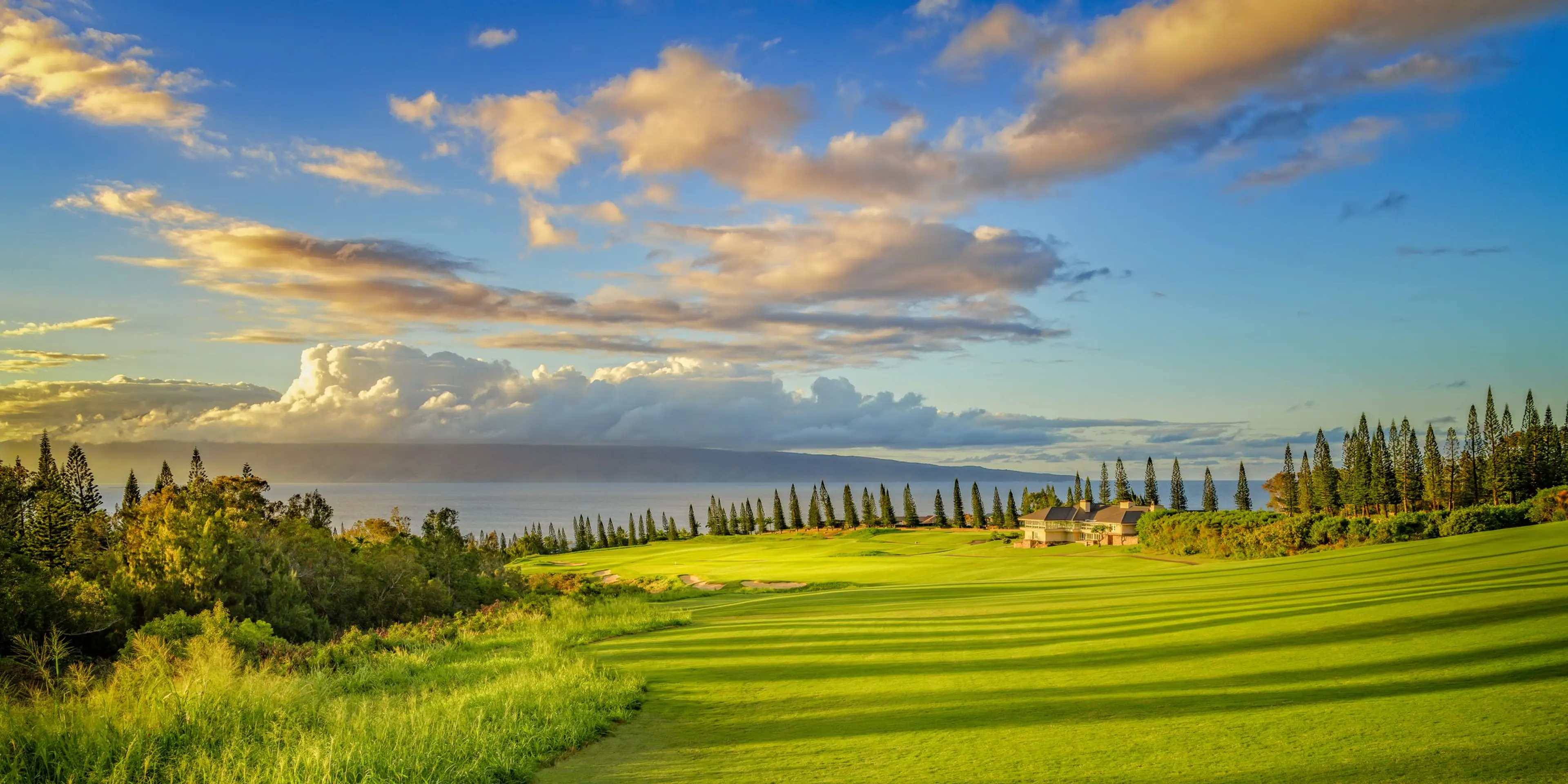 Landscape putting greens and fairway photo of the Kapalua golf course