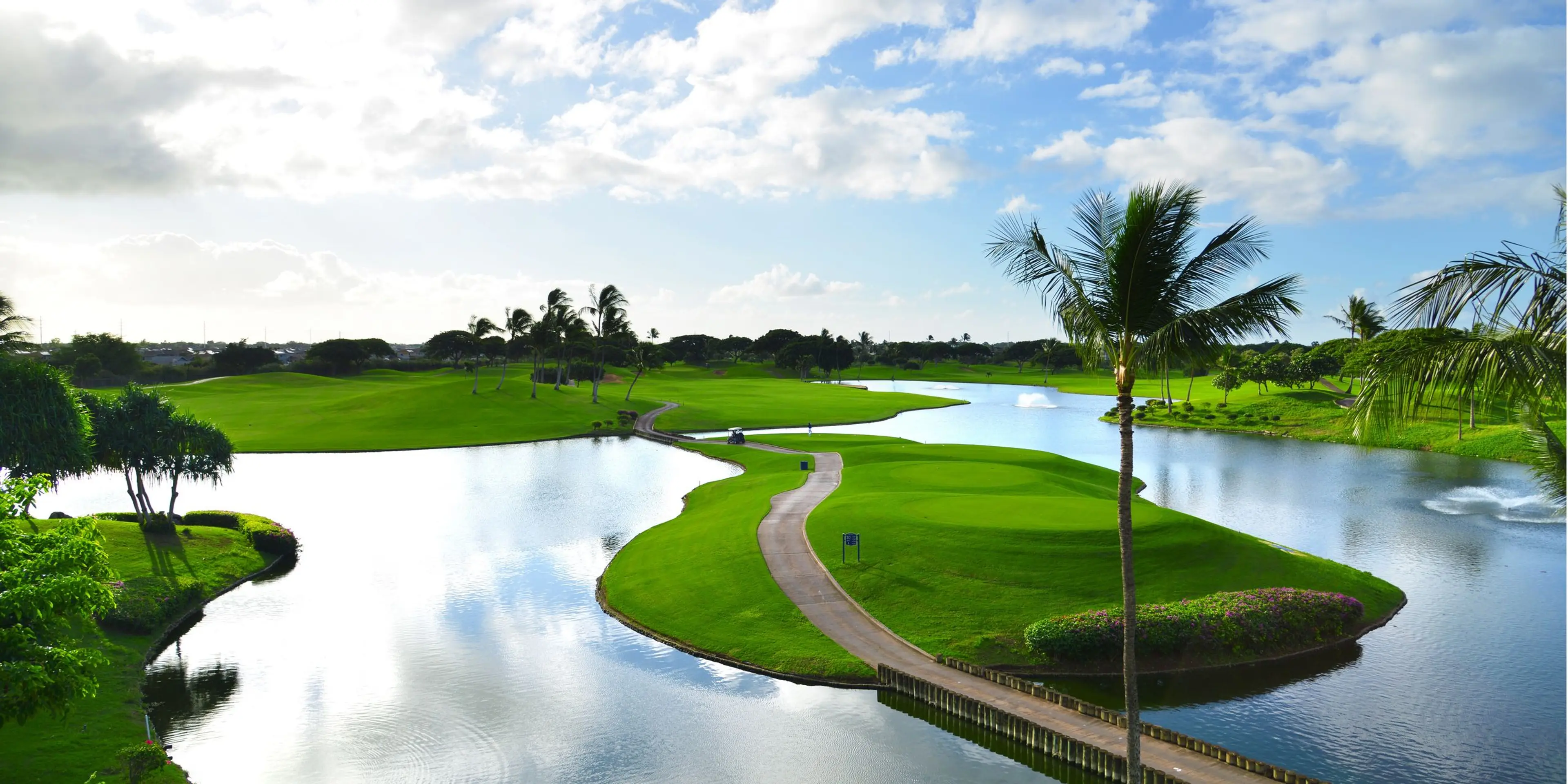 Landscape putting greens and fairway photo of the Kapolei Golf Club golf course