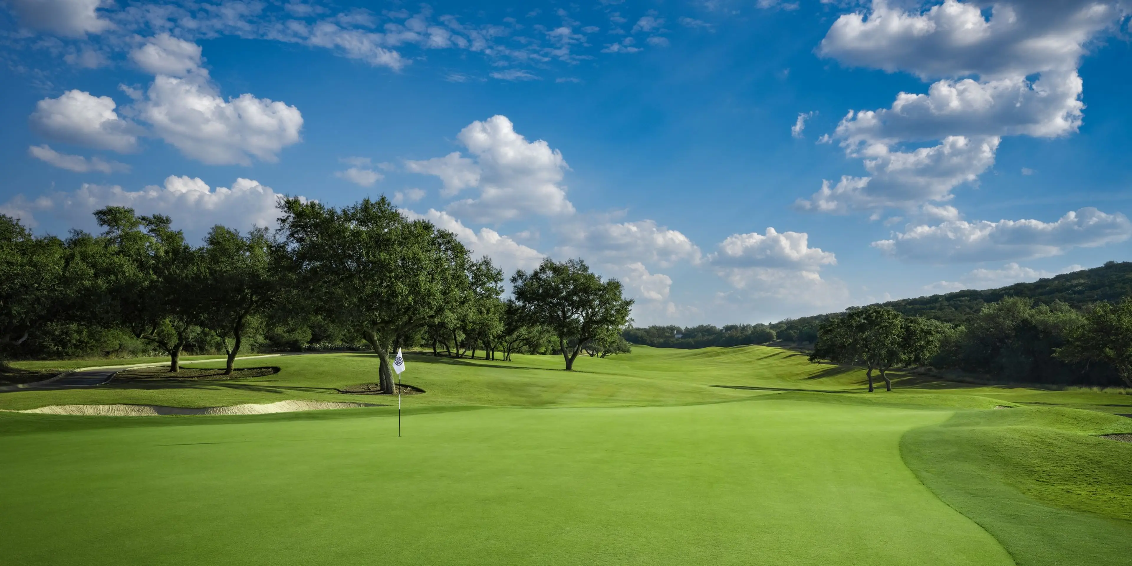 Landscape putting greens and fairway photo of the La Cantera Golf Club golf course