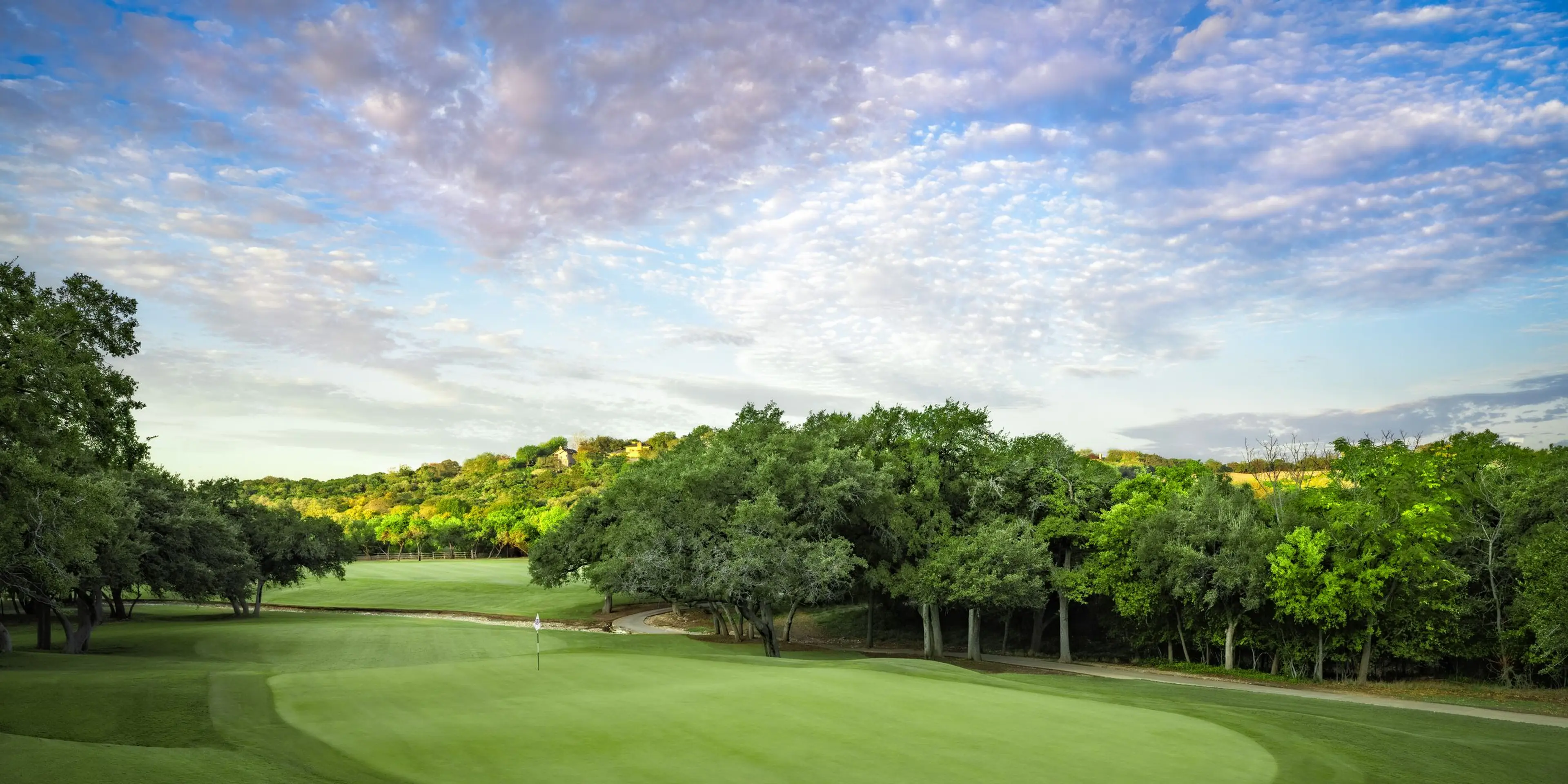 Landscape putting greens and fairway photo of the La Cantera Golf Club golf course
