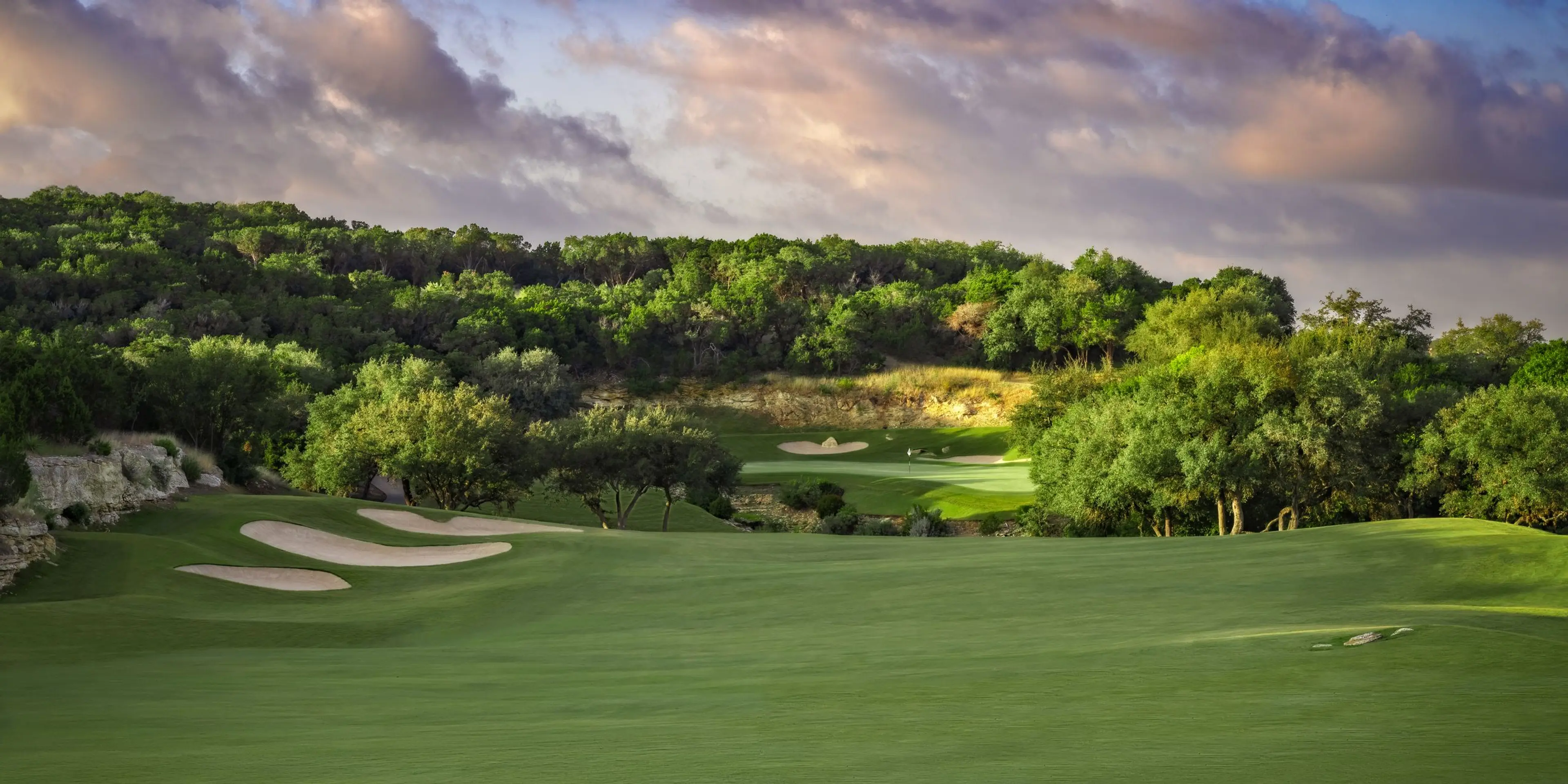 Landscape putting greens and fairway photo of the La Cantera Golf Club golf course