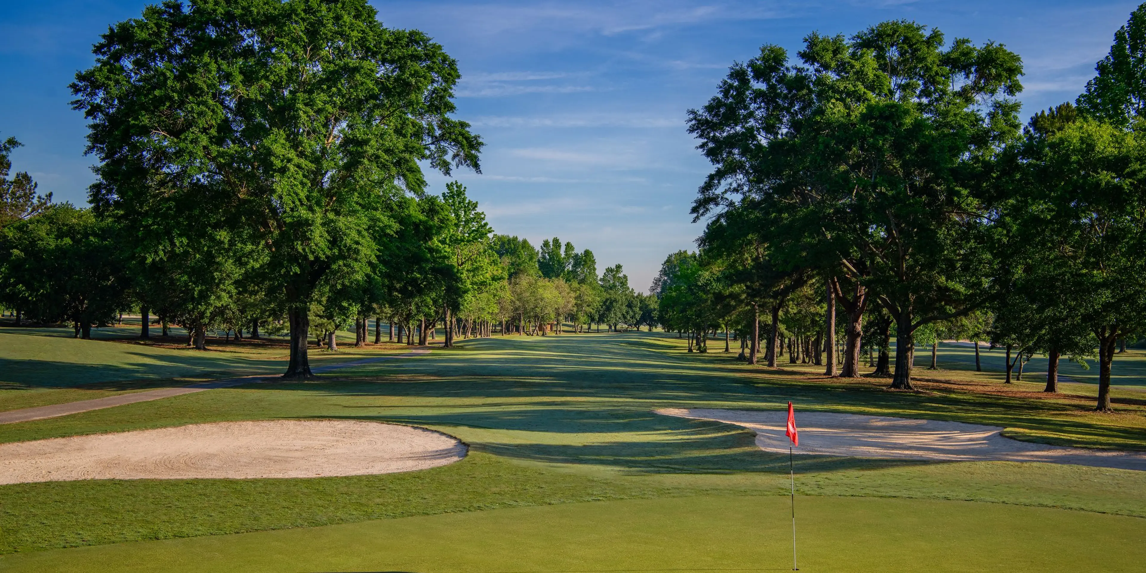 Landscape putting greens and fairway photo of the Lagoon Park Golf Course golf course