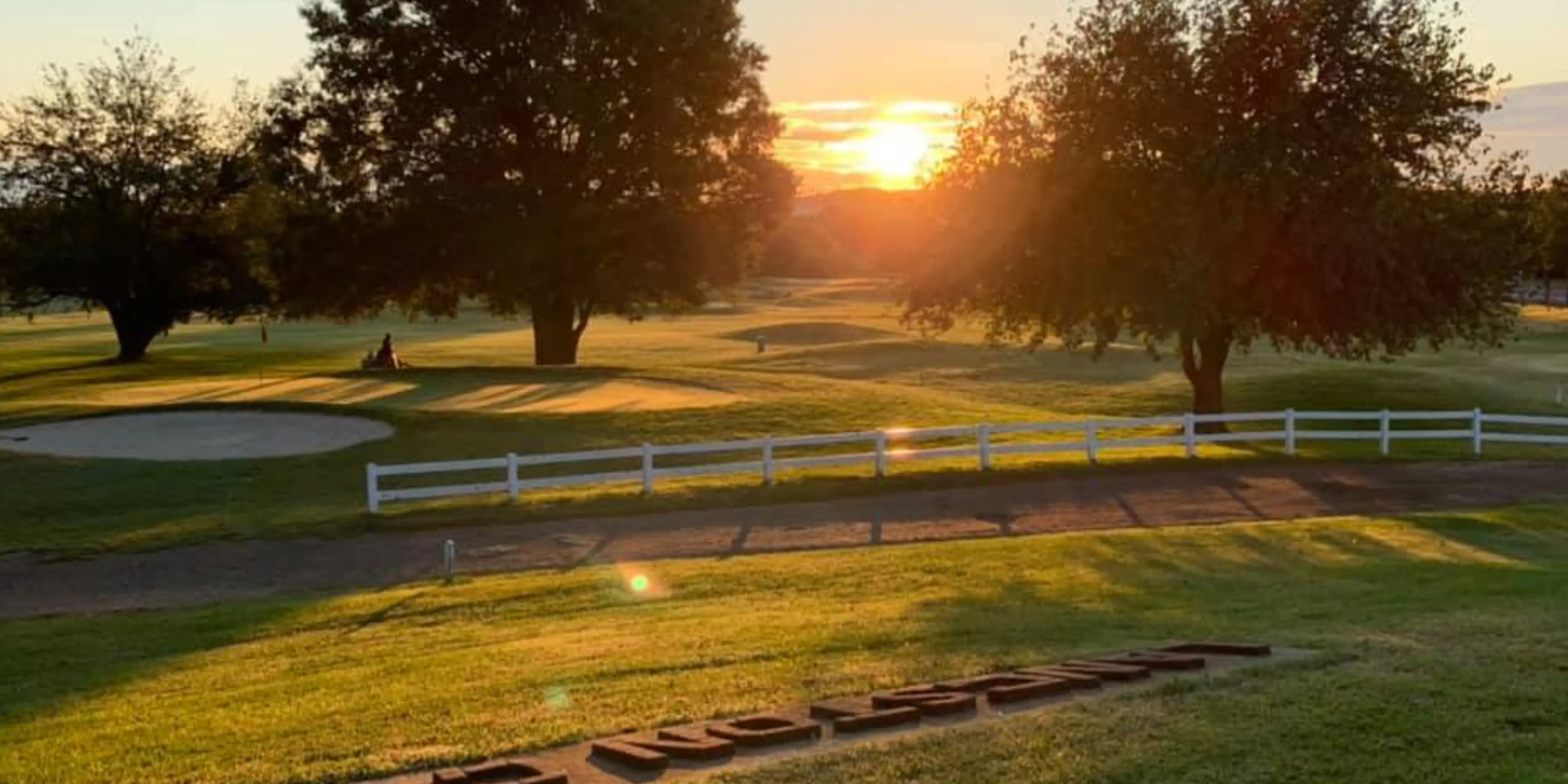 Landscape putting greens and fairway photo of the Langston Golf Course golf course