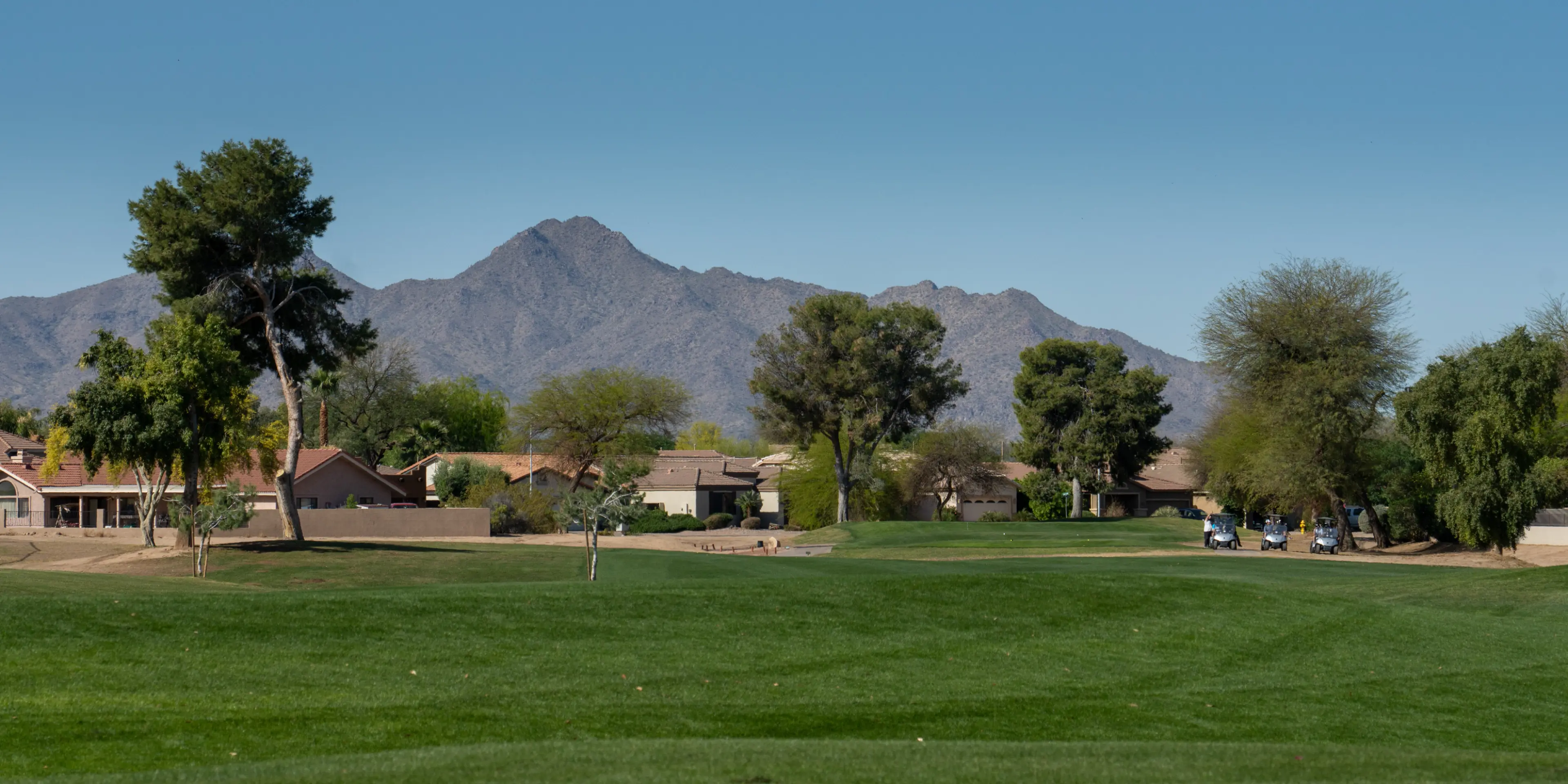 Landscape putting greens and fairway photo of the Las Colinas Golf Club golf course