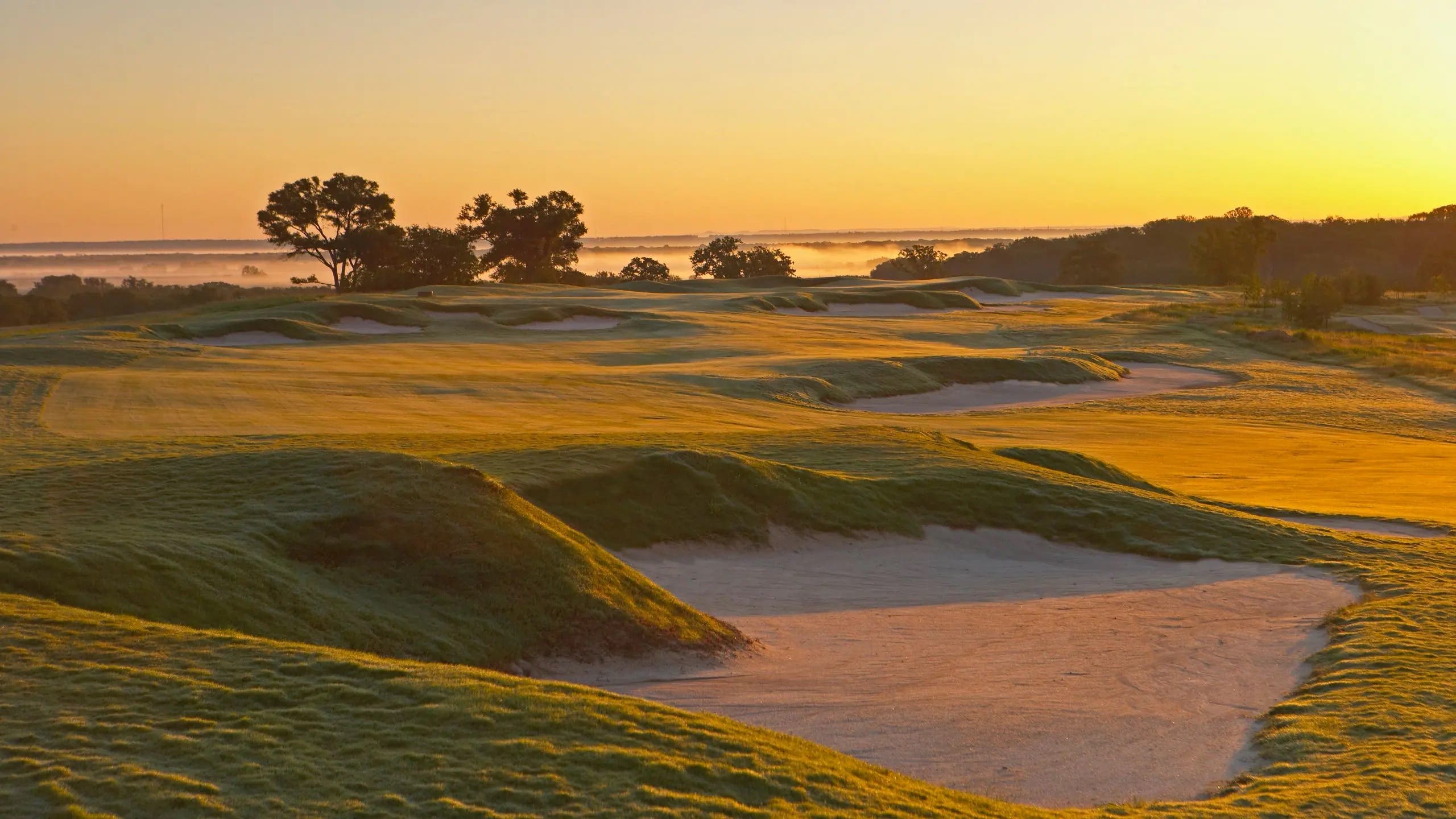 Landscape putting greens and fairway photo of the Lost Pines Golf Club golf course
