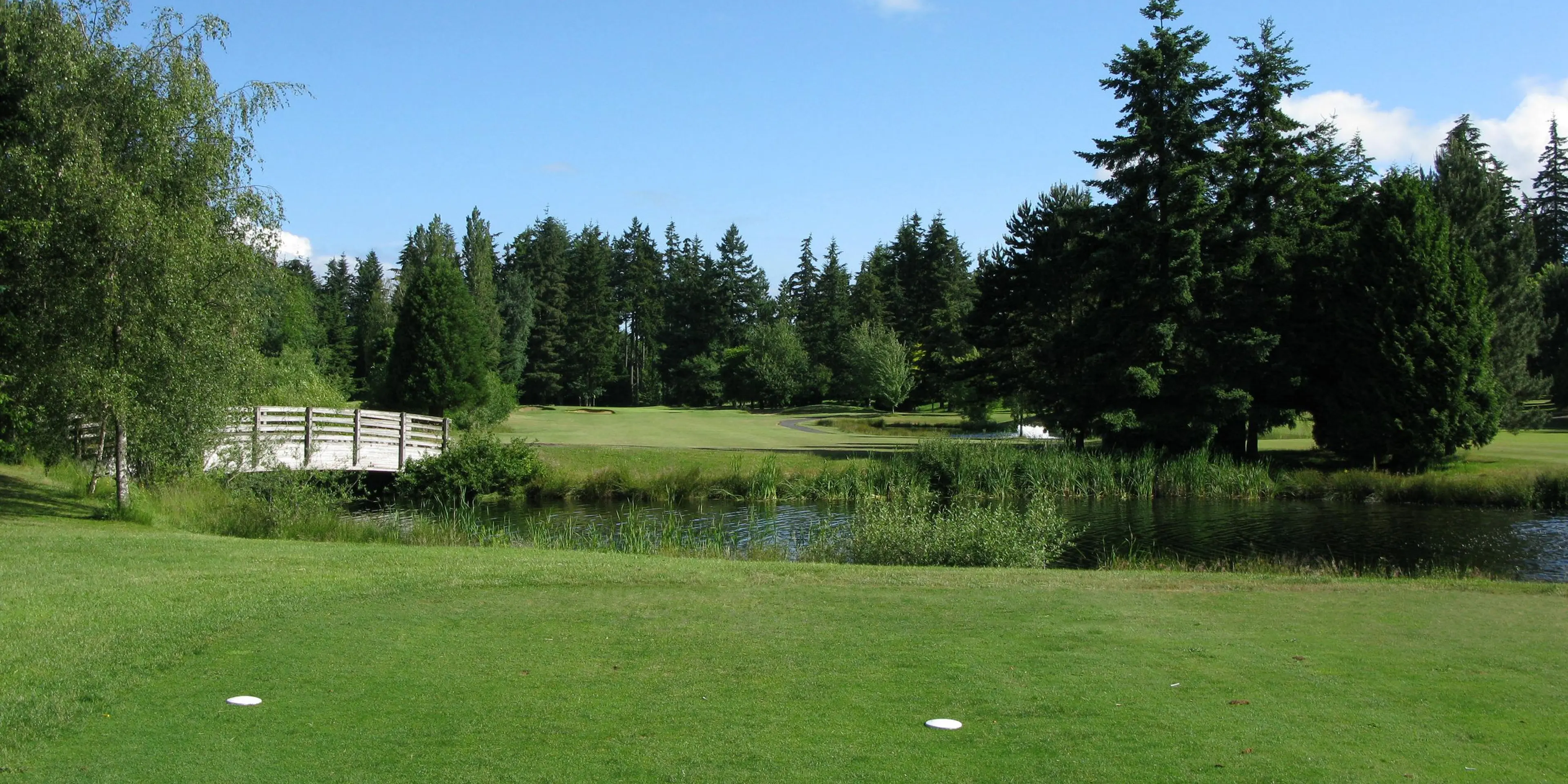 Landscape putting greens and fairway photo of the Lynnwood Golf Course golf course