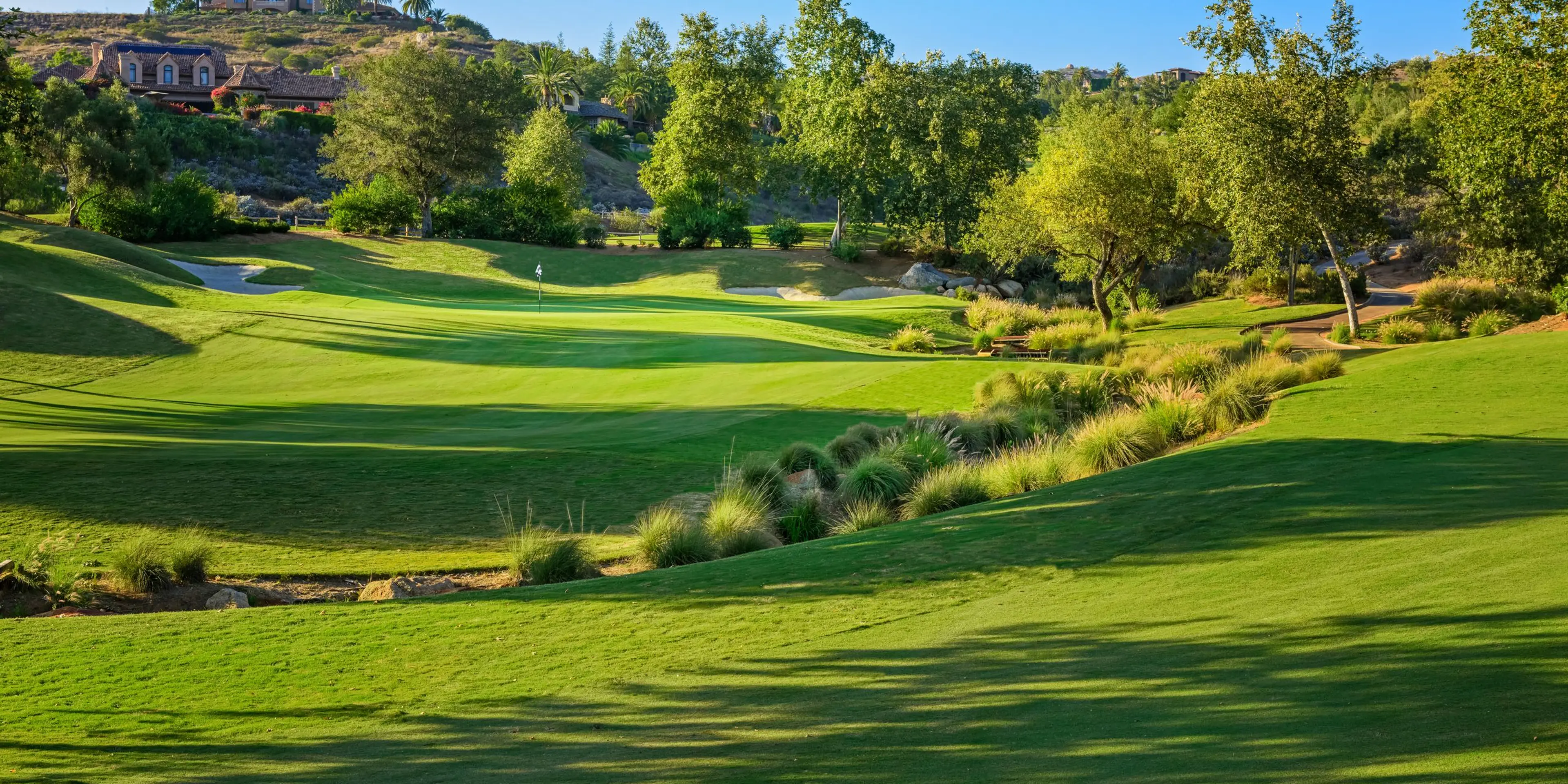 Landscape putting greens and fairway photo of the Maderas Golf Club golf course
