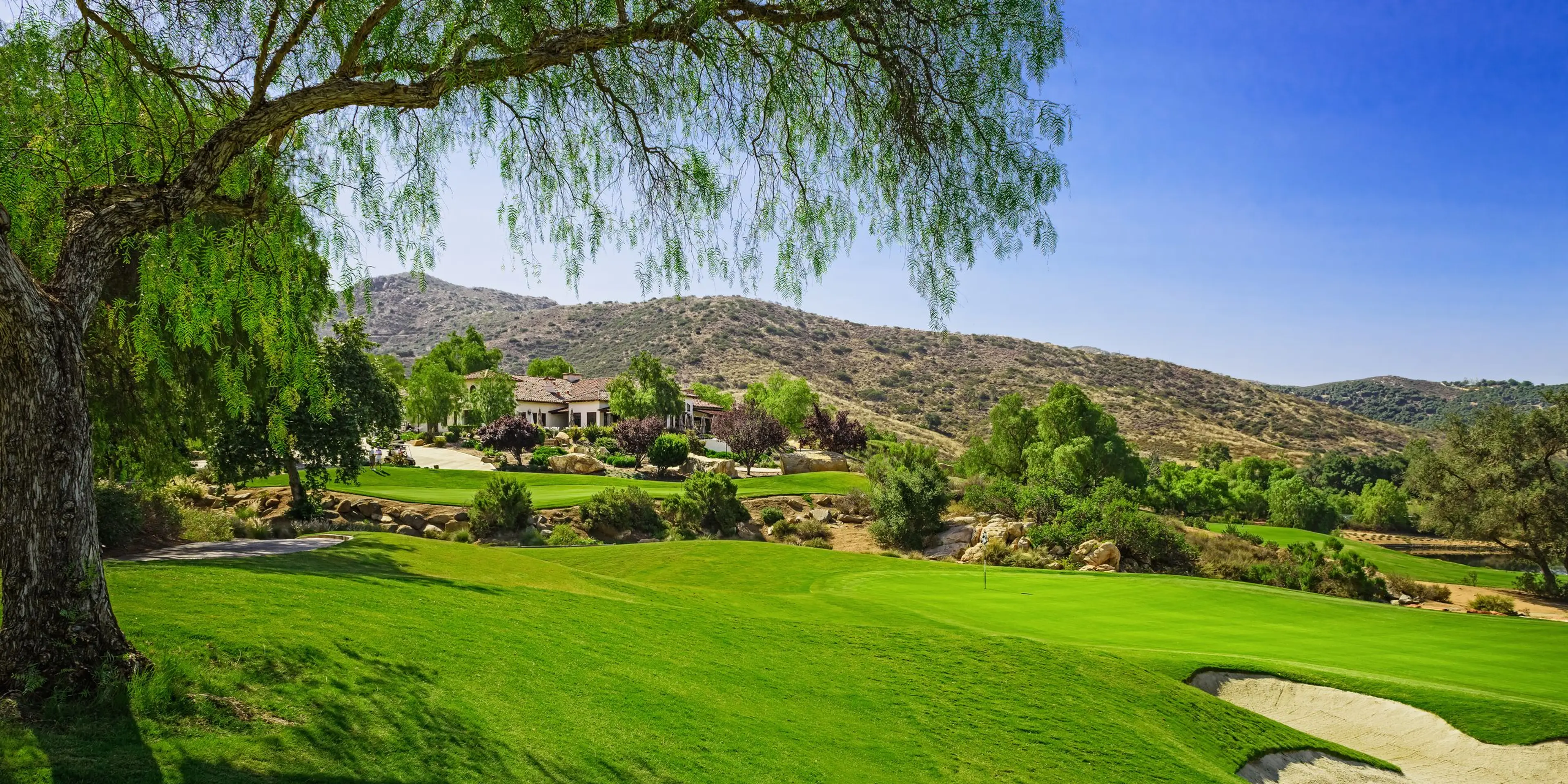 Landscape putting greens and fairway photo of the Maderas Golf Club golf course
