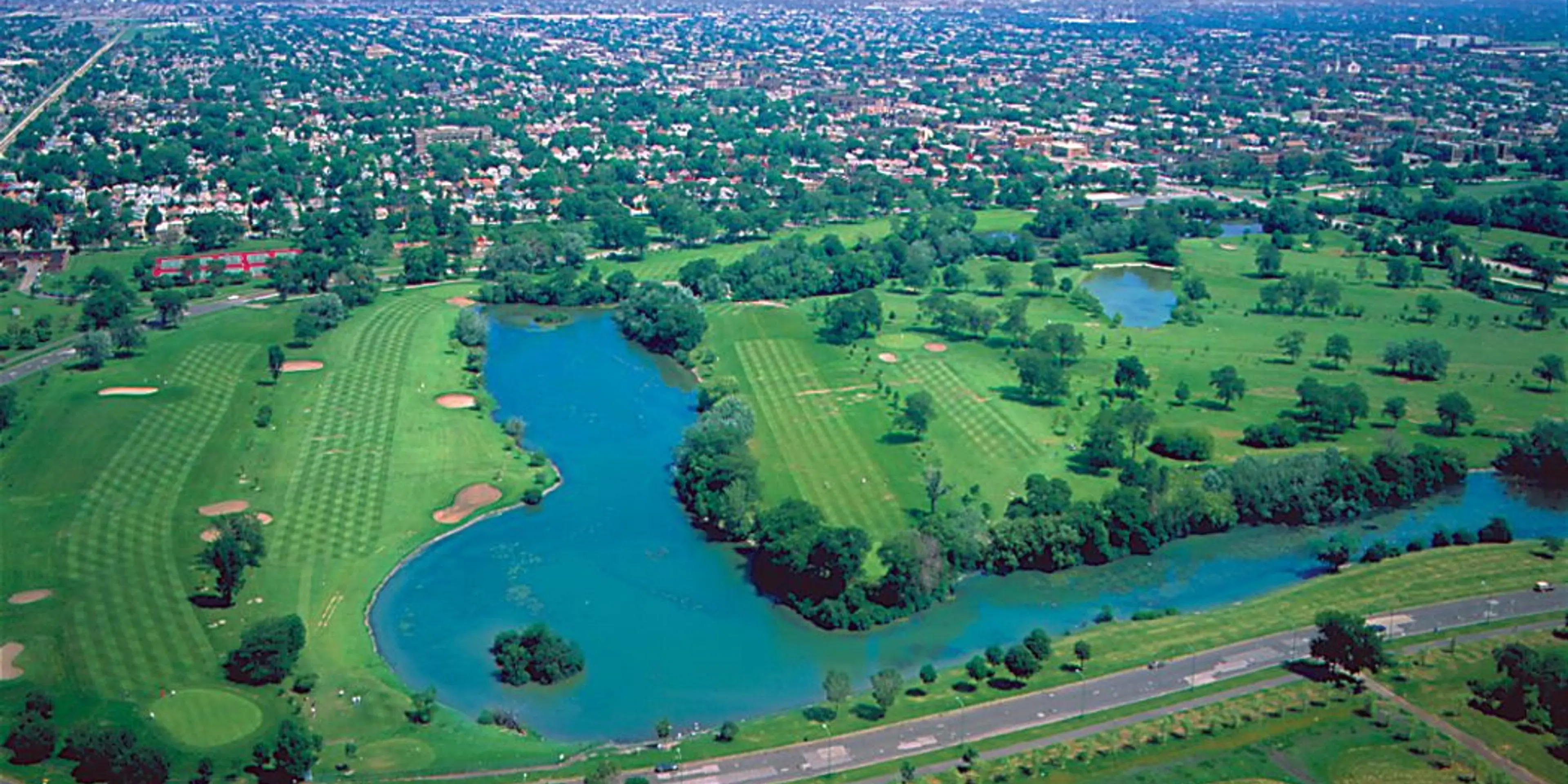 Landscape putting greens and fairway photo of the Marquette Park Golf Course golf course