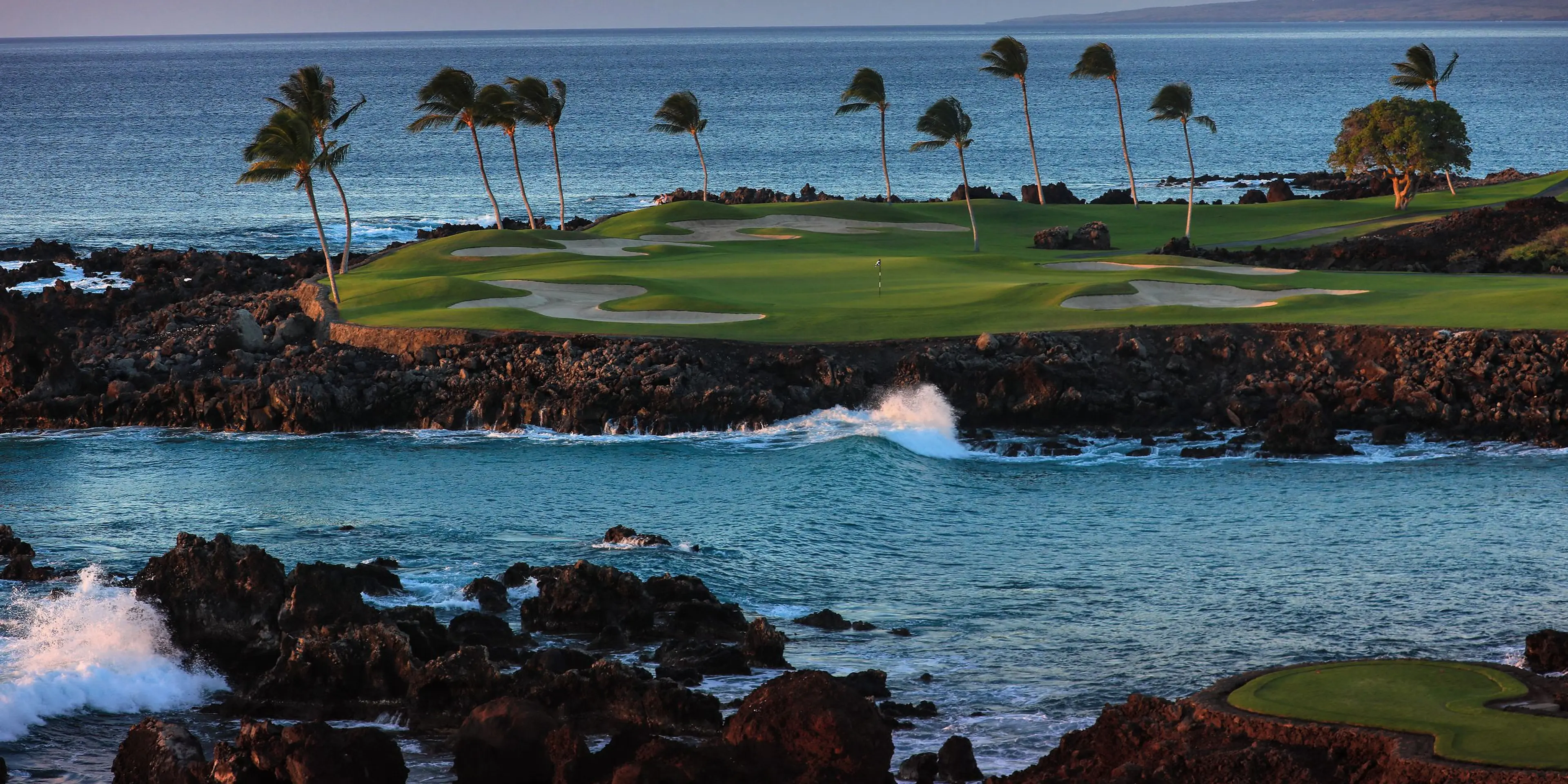 Landscape putting greens and fairway photo of the Mauna Lani Auberge Collection golf course