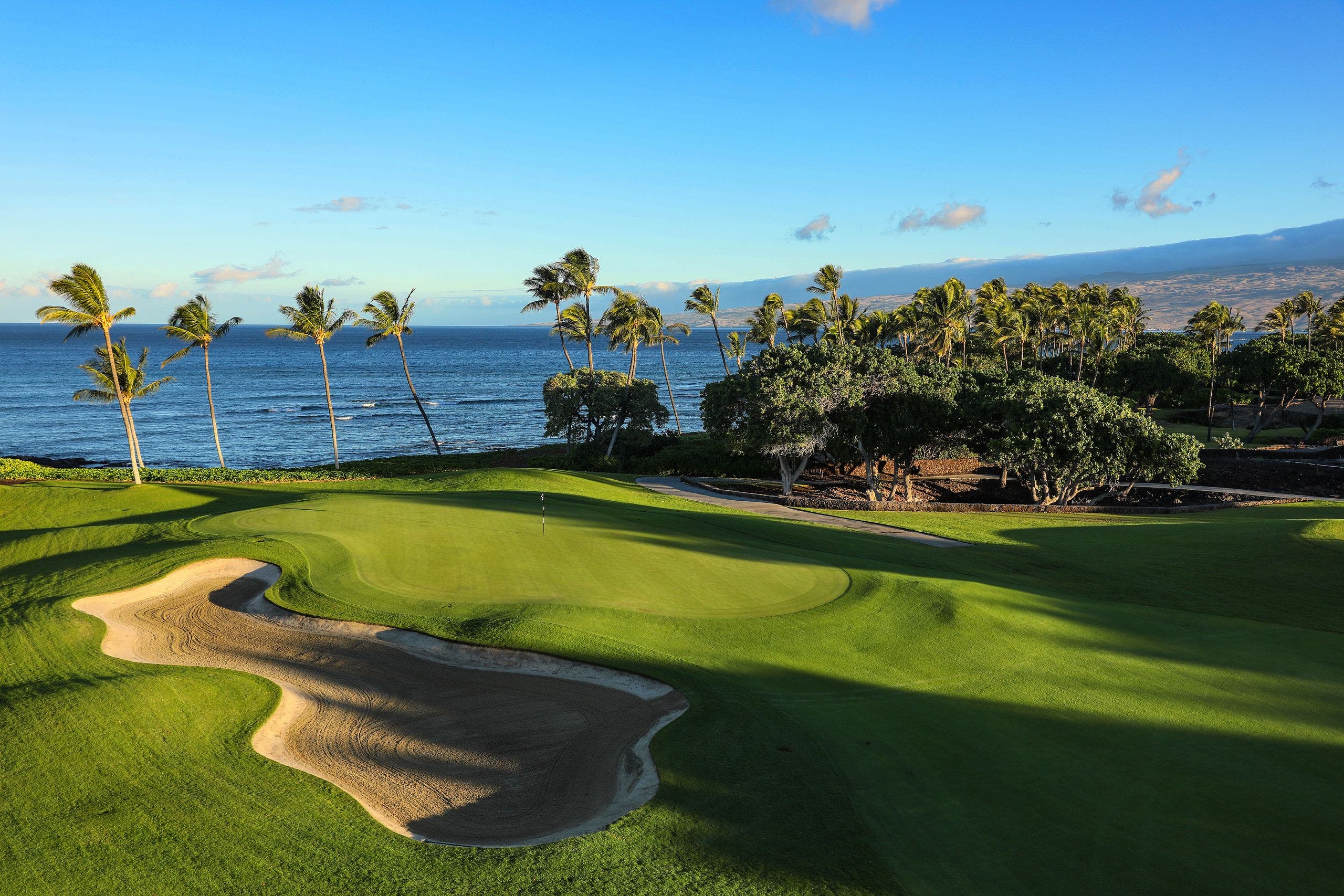 Landscape putting greens and fairway photo of the Mauna Lani Auberge Collection golf course