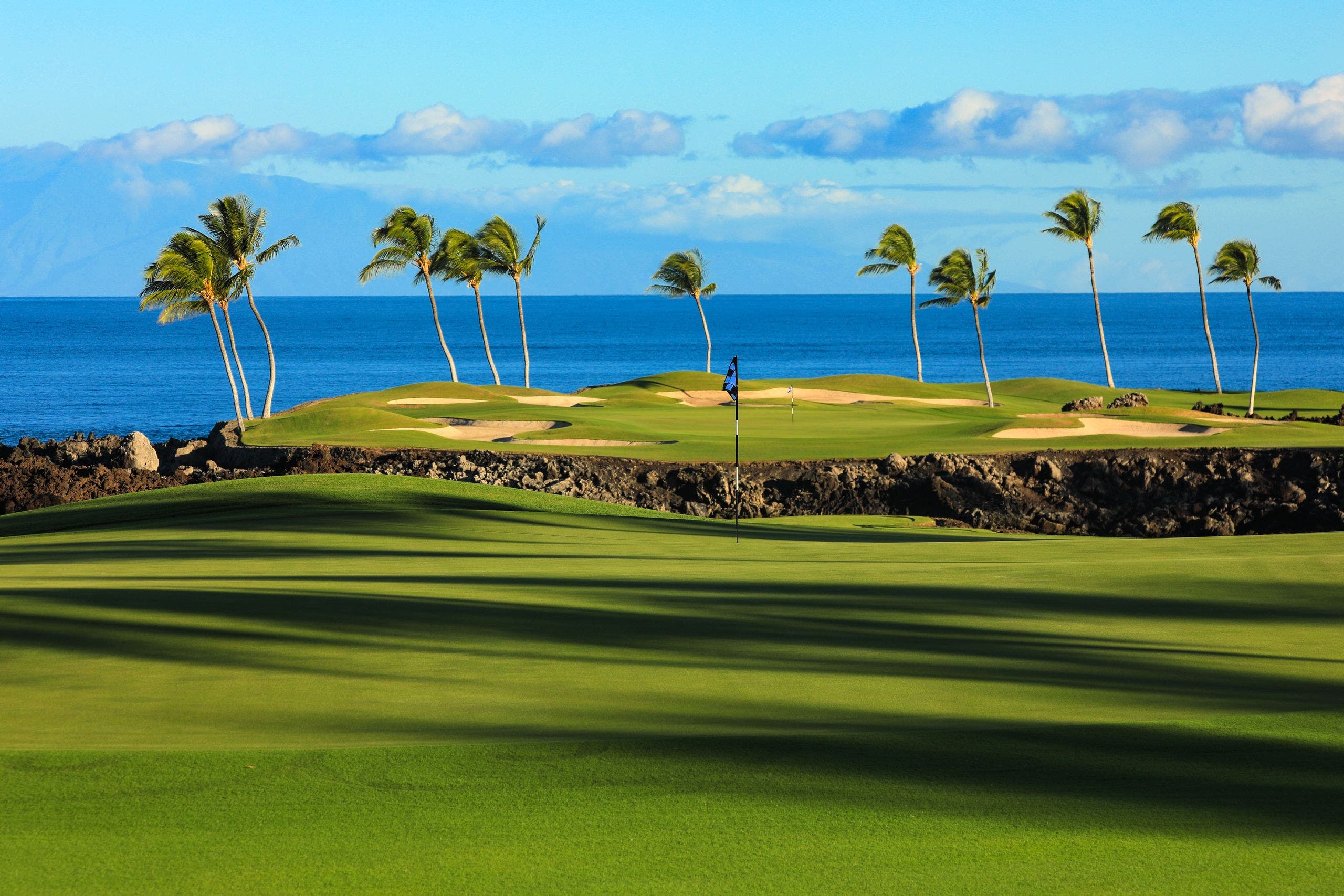 Landscape putting greens and fairway photo of the Mauna Lani Auberge Collection golf course