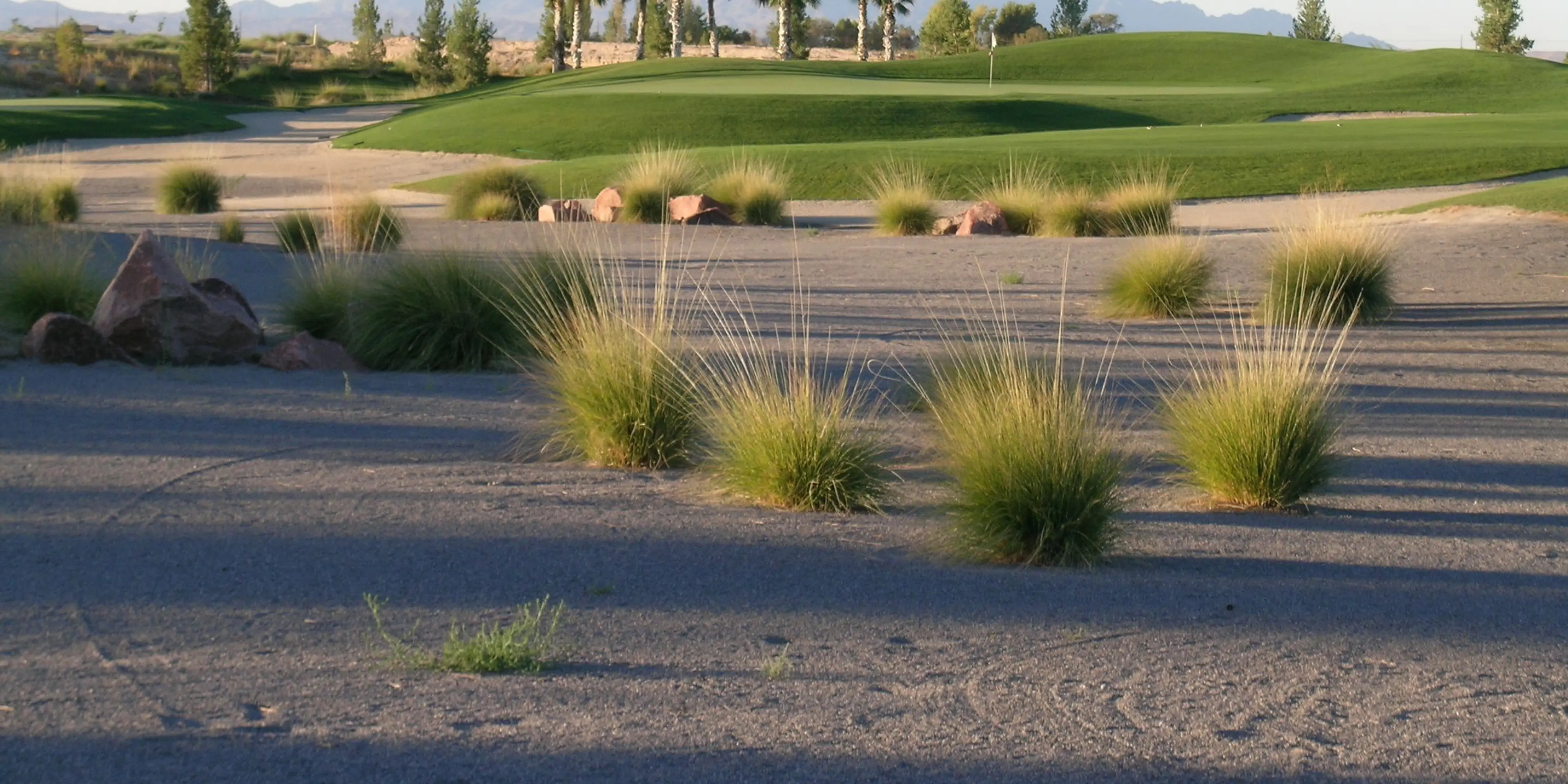 Landscape putting greens and fairway photo of the Mountain Falls Golf Club golf course