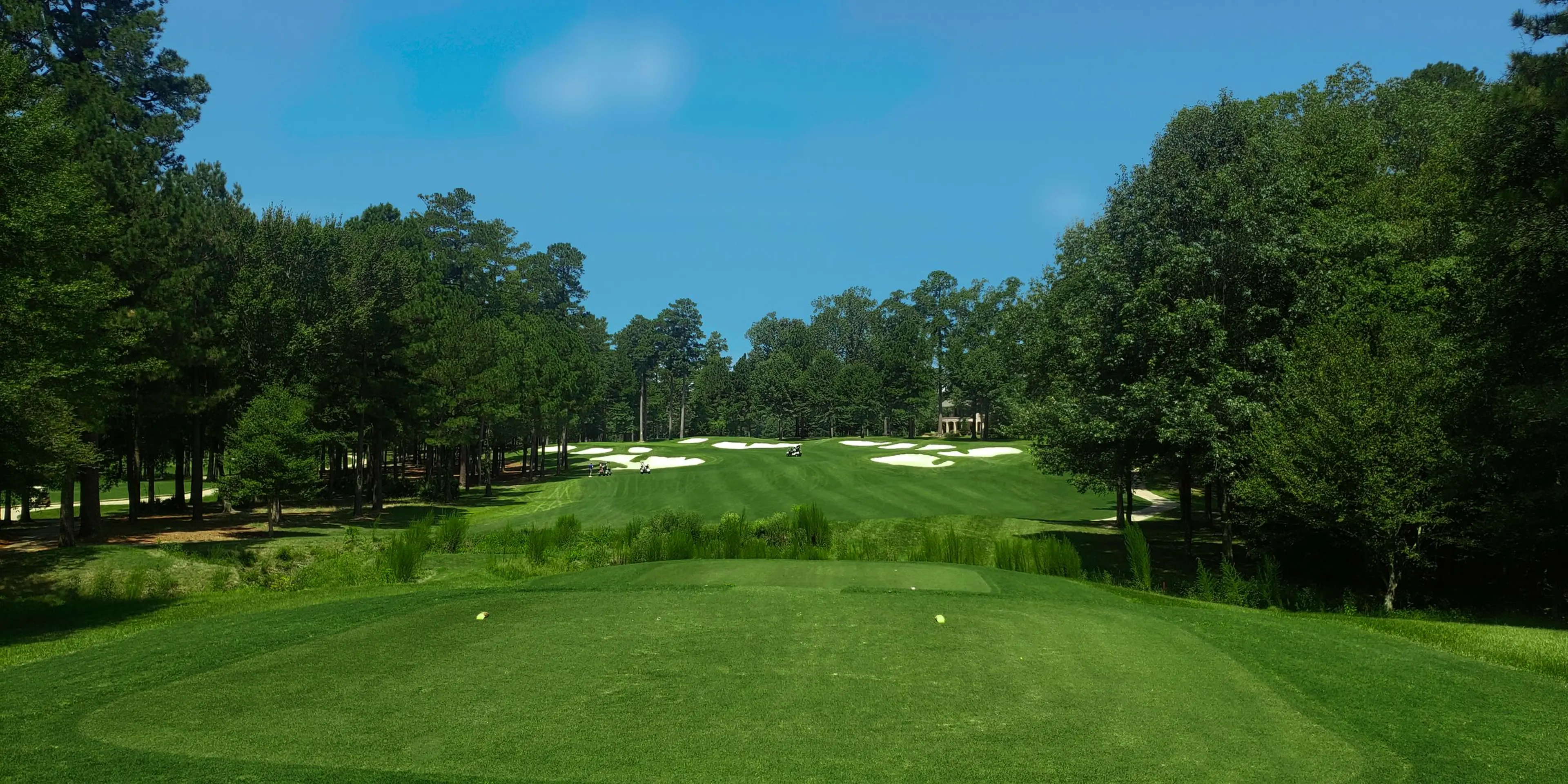 Landscape putting greens and fairway photo of the Mystic Creek Golf Club golf course