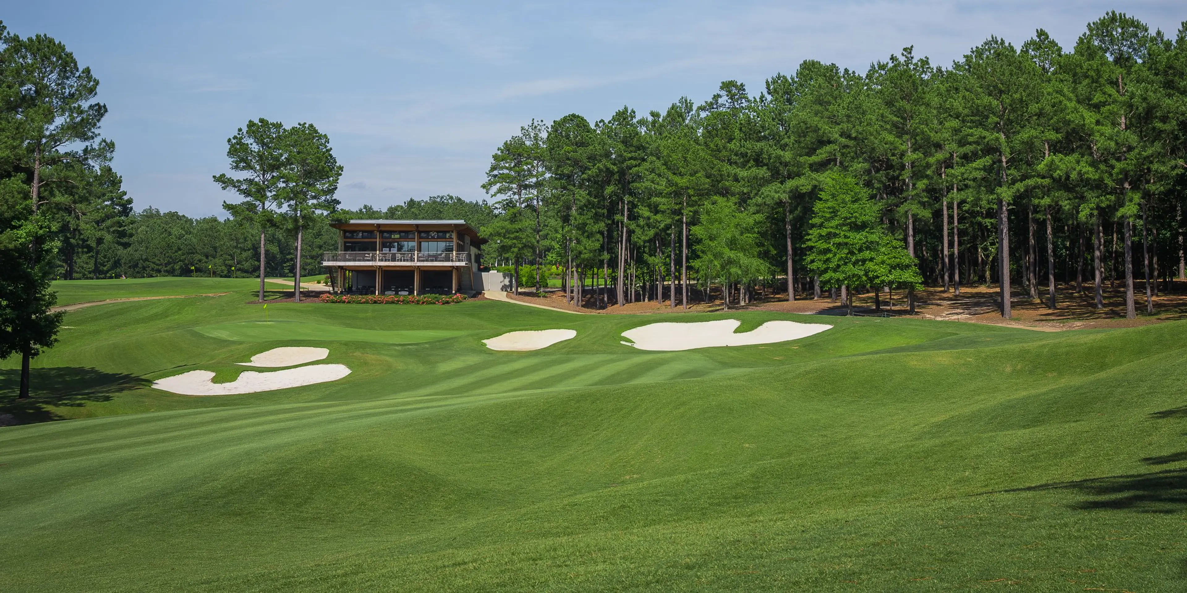 Landscape putting greens and fairway photo of the Mystic Creek Golf Club golf course