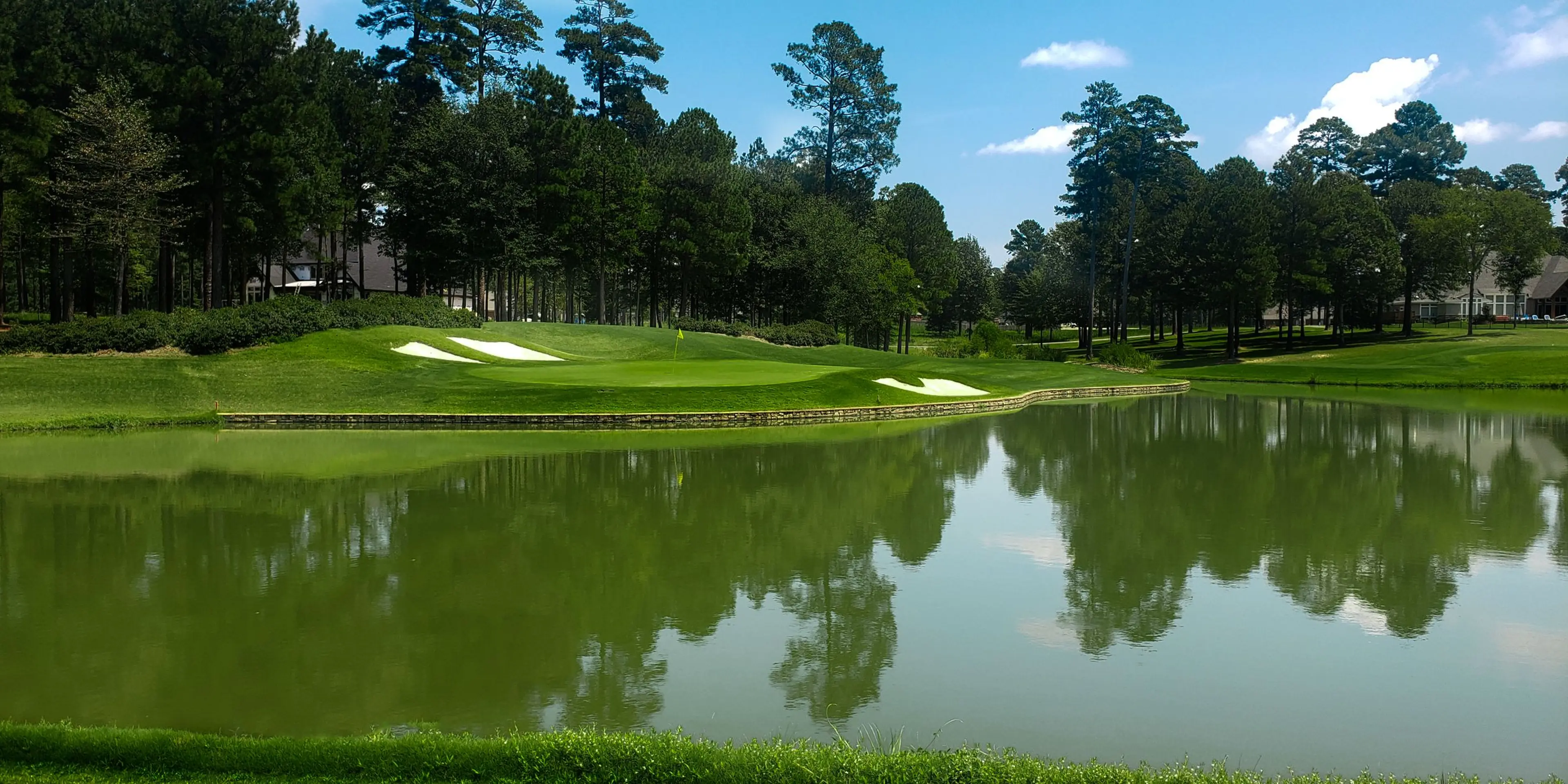 Landscape putting greens and fairway photo of the Mystic Creek Golf Club golf course
