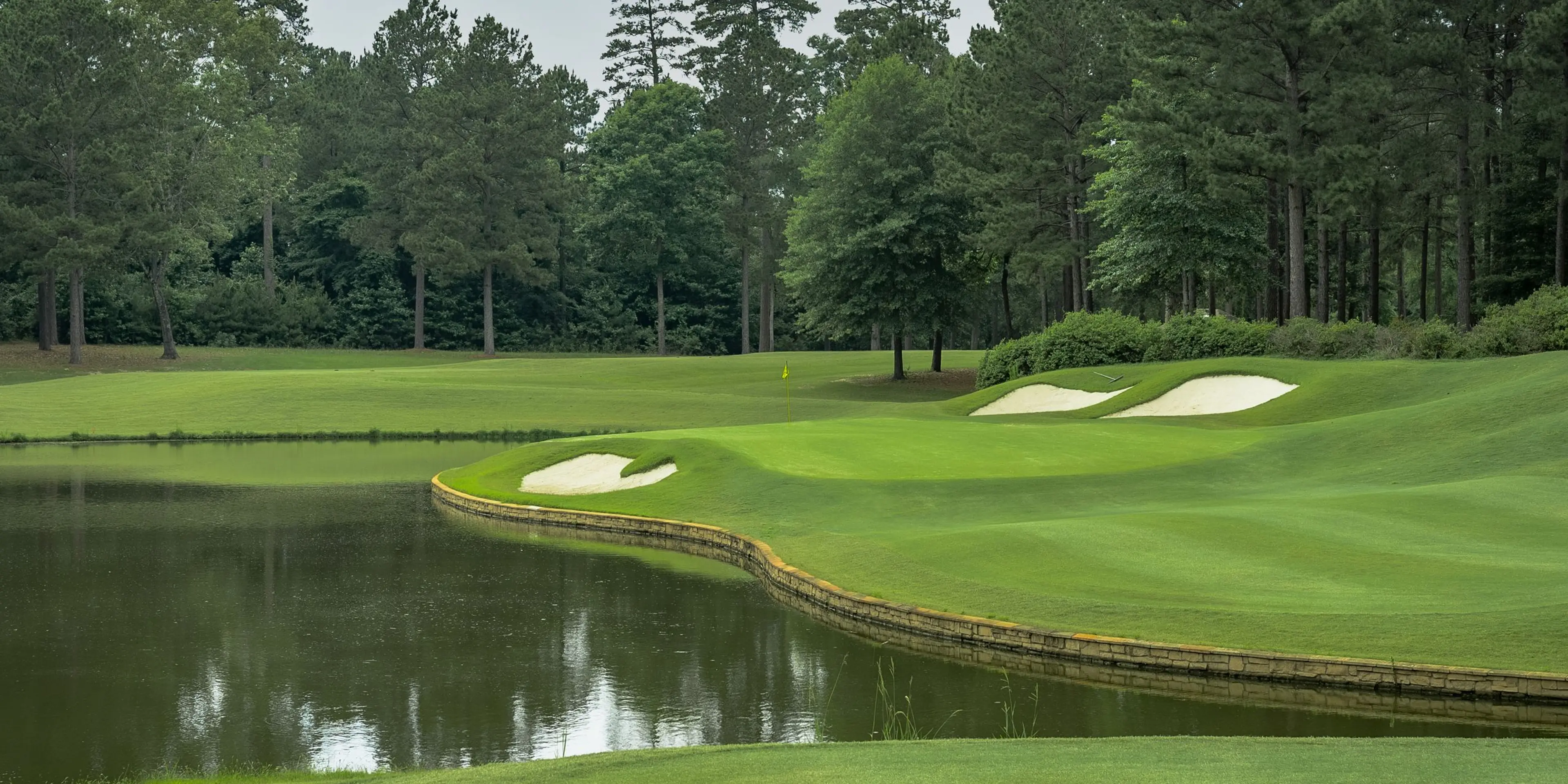 Landscape putting greens and fairway photo of the Mystic Creek Golf Club golf course