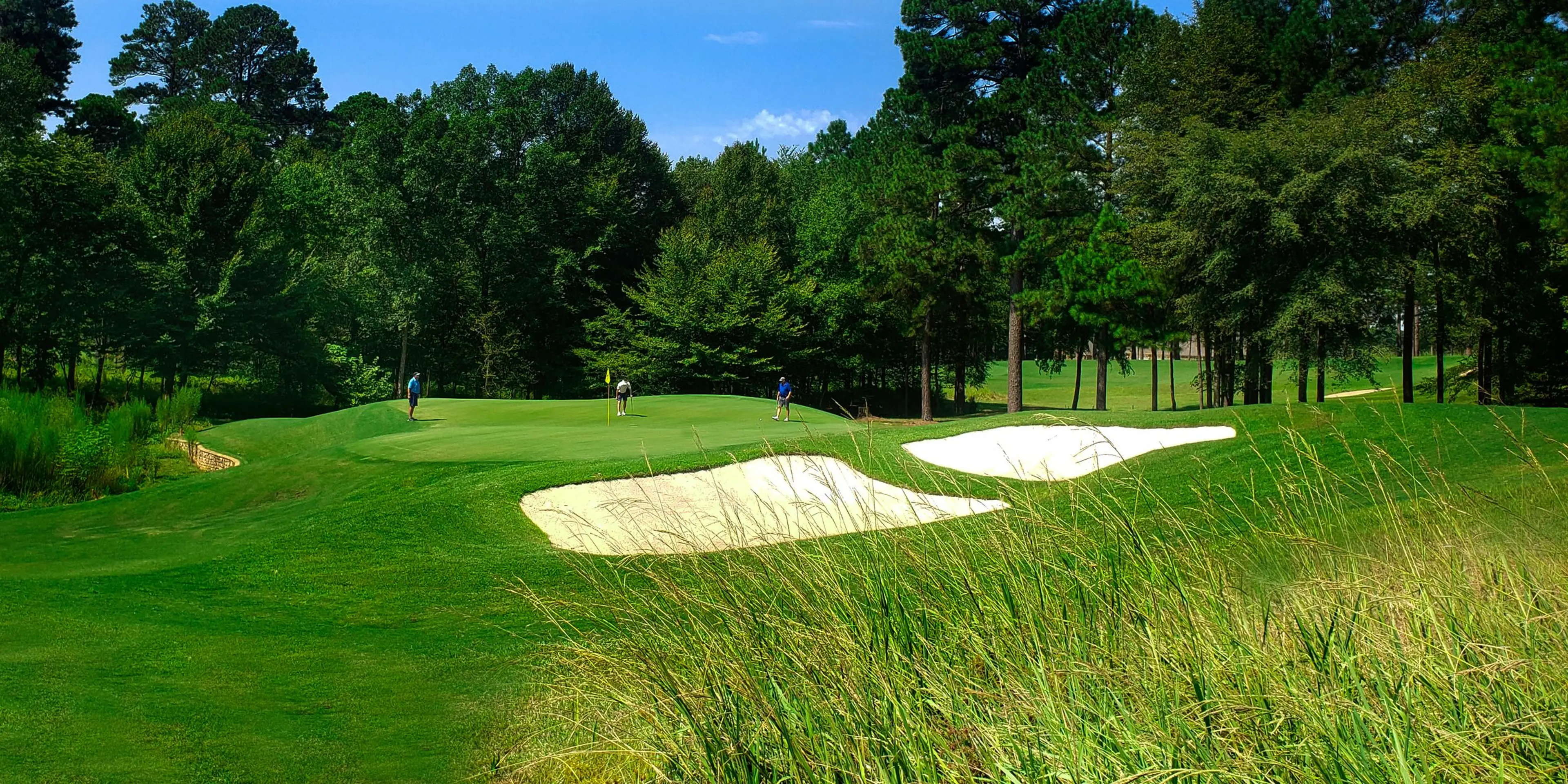 Landscape putting greens and fairway photo of the Mystic Creek Golf Club golf course