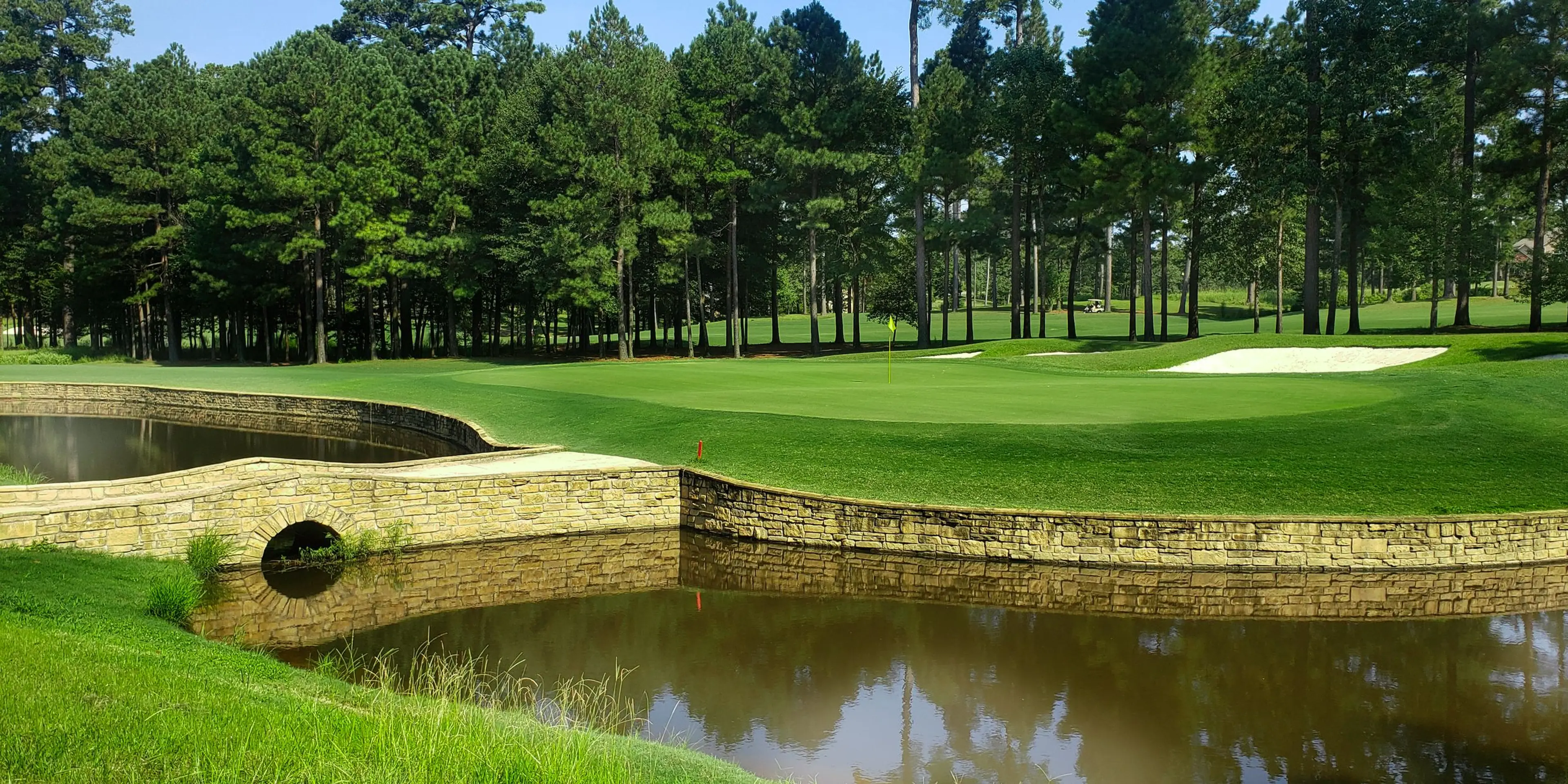 Landscape putting greens and fairway photo of the Mystic Creek Golf Club golf course