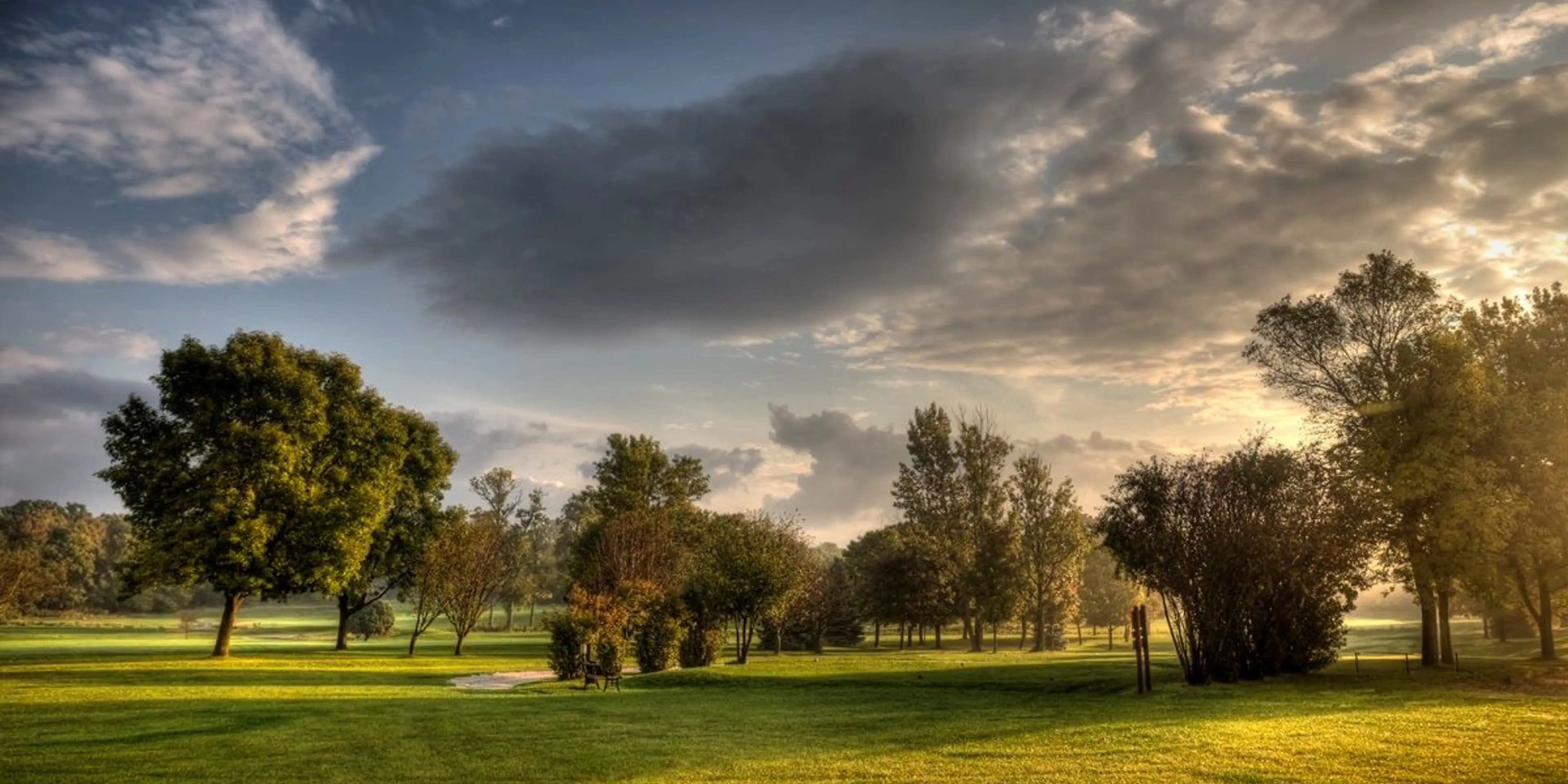 Landscape putting greens and fairway photo of the New Berlin Hills Golf Course golf course